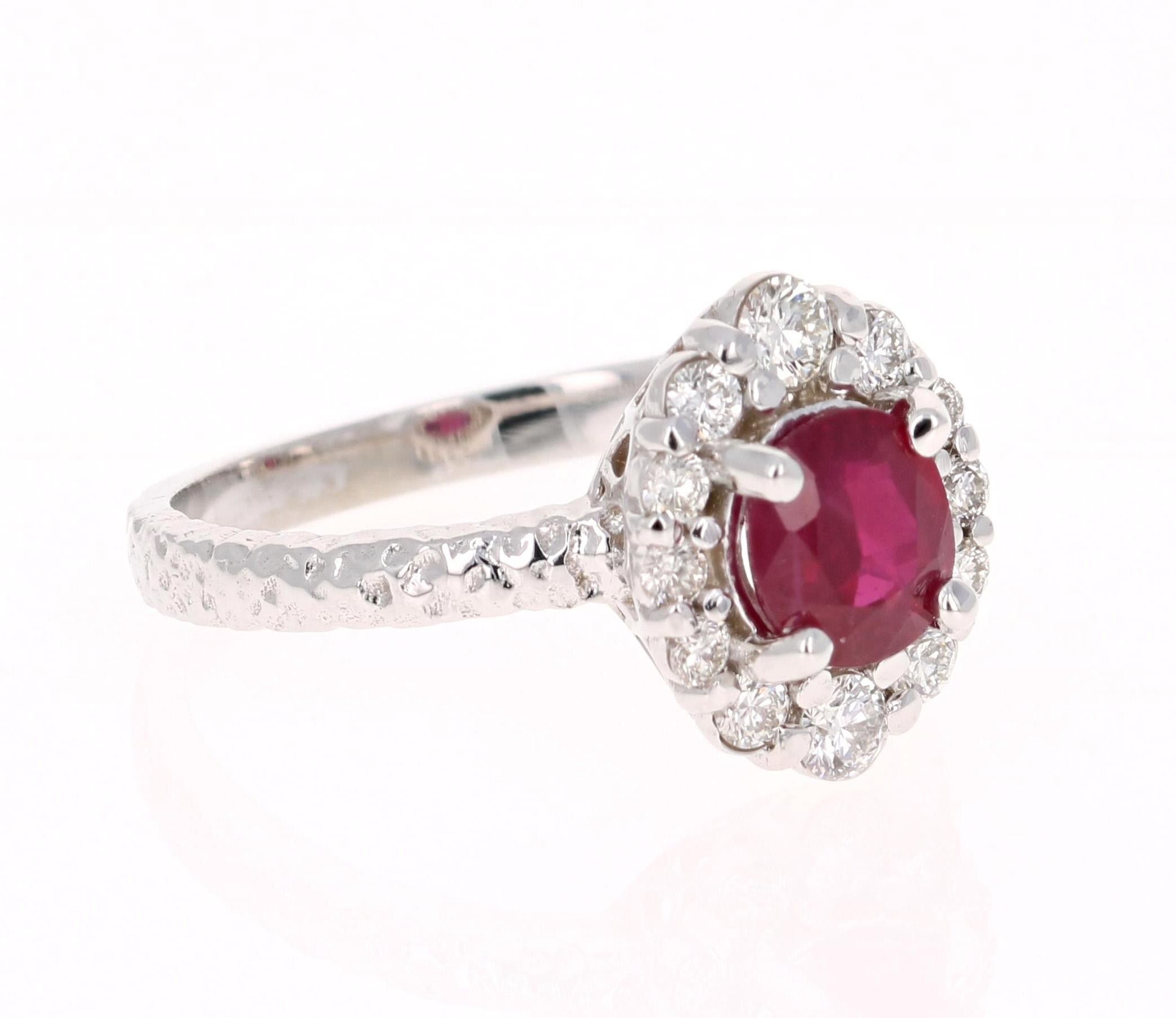 Stunning Ruby Diamond Ring that can easily transform into a unique Bridal ring for that special someone!
This ring has a 1.07 Carat Oval Cut Burmese Ruby that is set in the center and is surrounded by 12 Round Cut Diamonds that weigh 0.39 carats.  