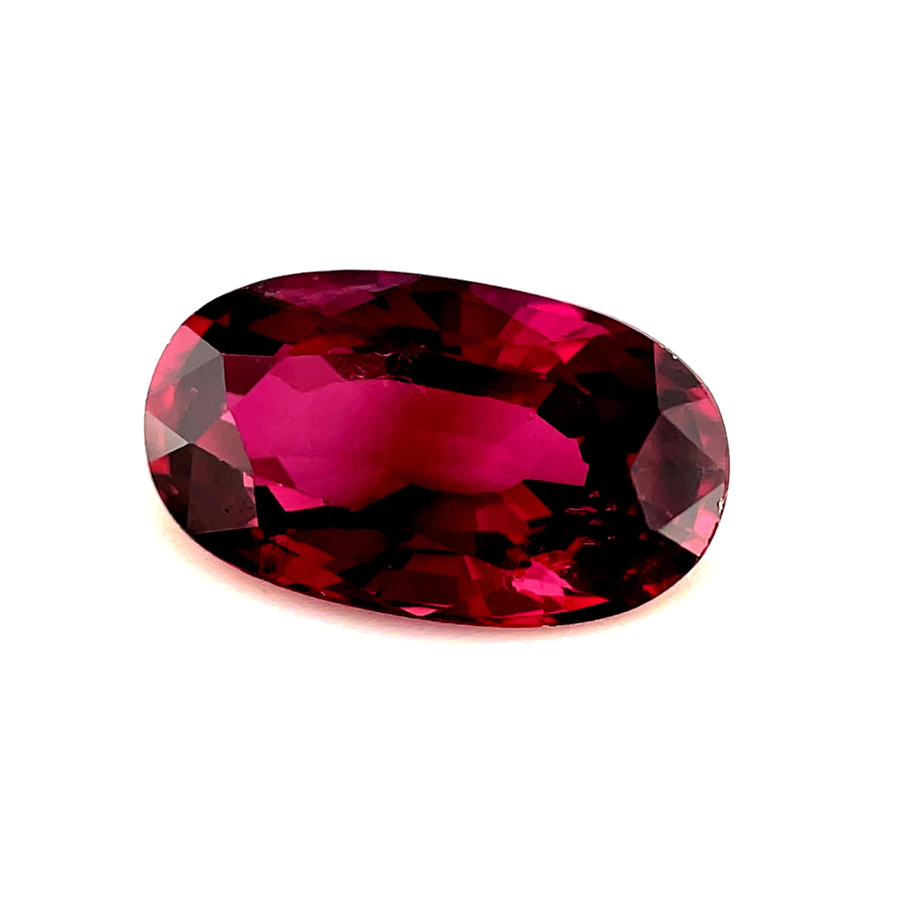 This beautiful 1.46 carat oval ruby has rich, cranberry red color and sparkling pink highlights! It is eye-clean and measures 8.76 x 5.03 millimeters with an elegant, slender outline that will make a beautiful piece of jewelry! The longer sides of
