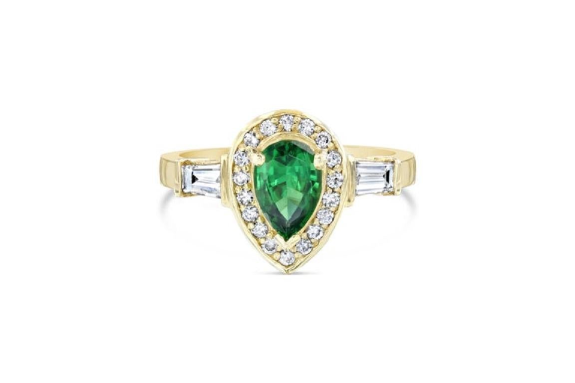 This ring has a Pear Cut Natural Tsavorite which weighs 0.90 carats and is surrounded by a sing halo of 17 Round Cut Diamonds that weighs 0.19 carats and 4 Baguette Cut Diamonds that weigh 0.37 carats. The total carat weight of the ring is 1.46
