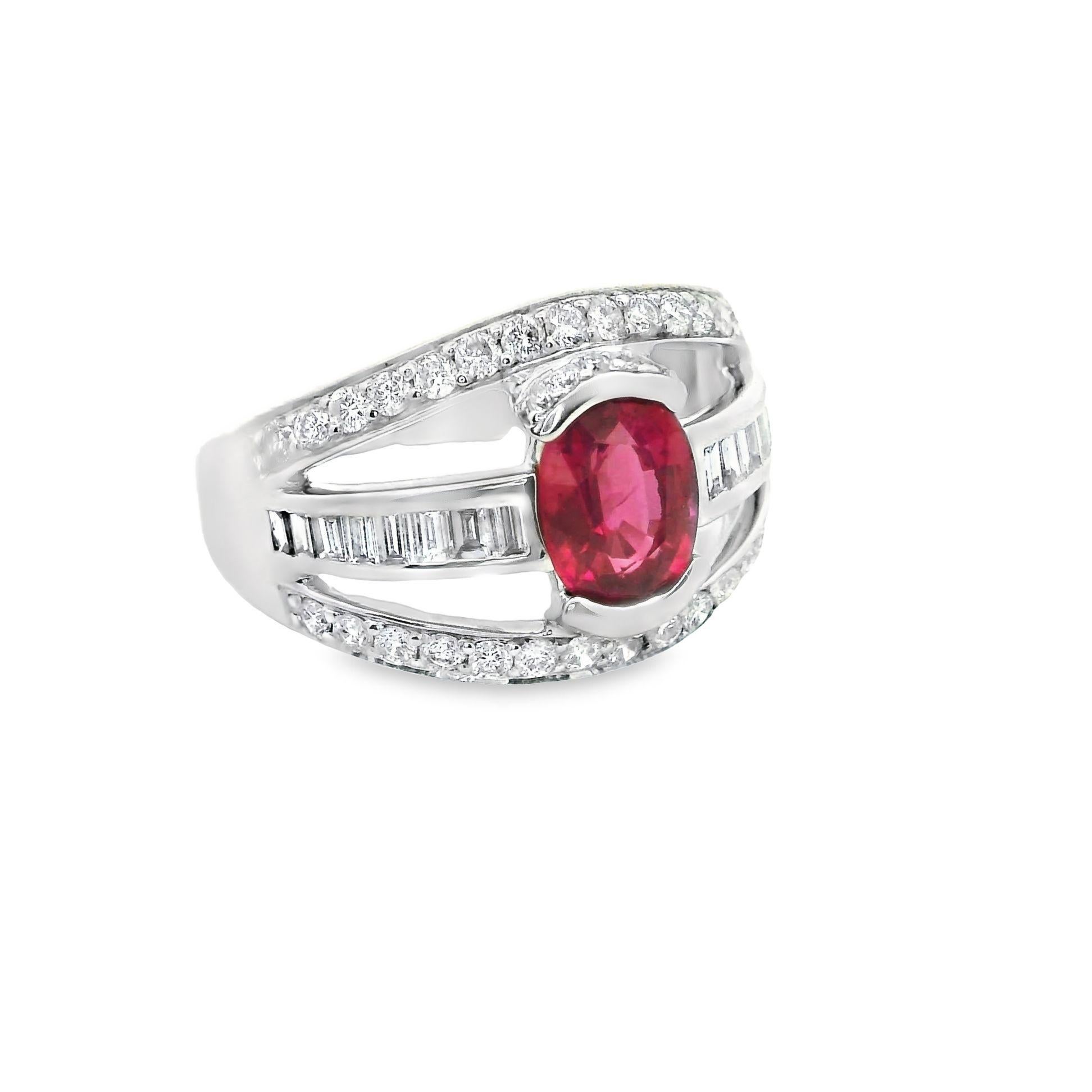 A stylish platinum band ring featuring a fine 1.46 carat ruby. The ruby has a lovely oval-shape along with a vibrant and lively color that sparkles in the light. It is complemented by three rows of baguette and round brilliant-cut diamonds weighing