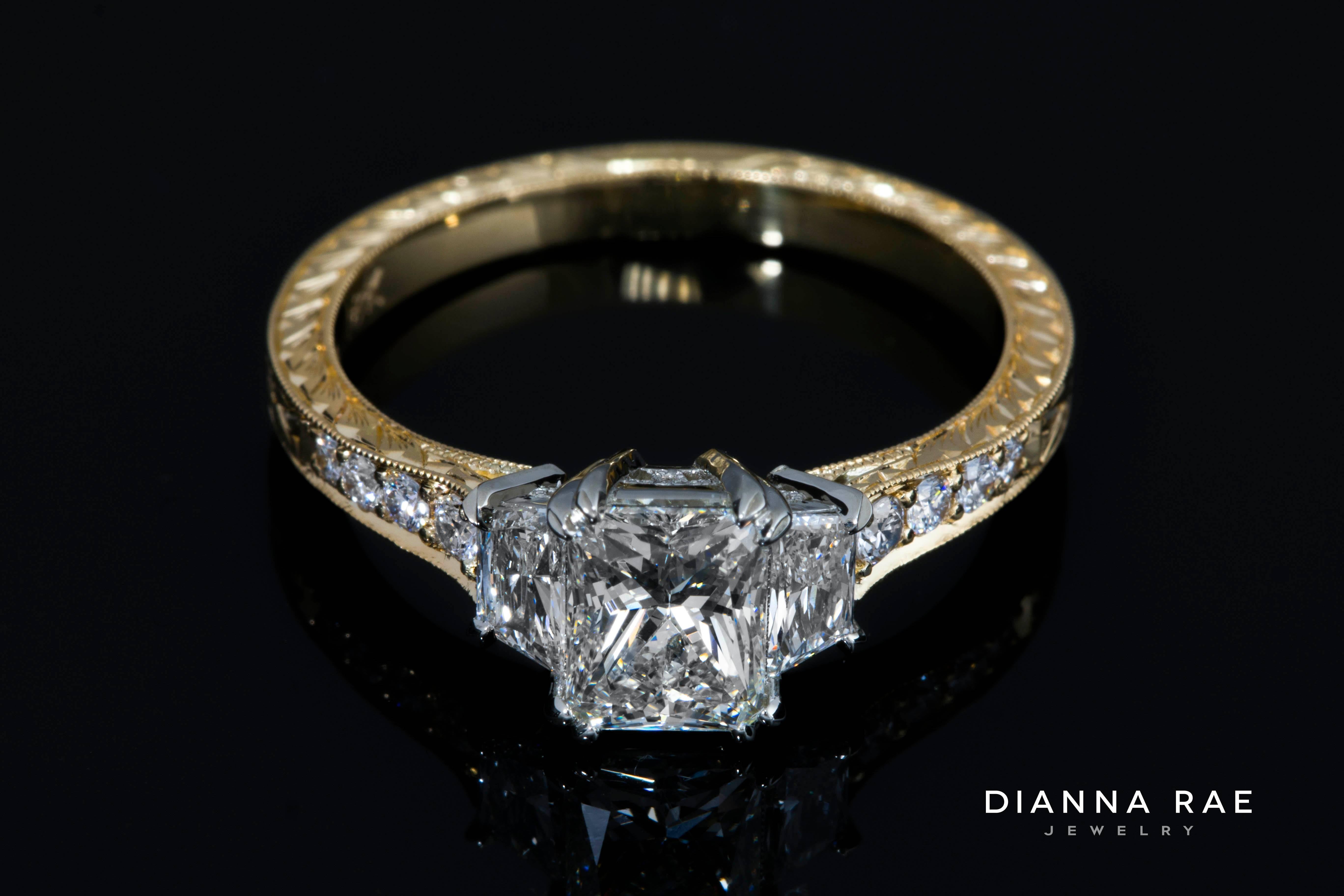 1.46ct tw Radiant Diamond Engagement Ring with Hand Engraved 18K Yellow Gold

This diamond ring is a one-of-a-kind, handmade in 18K yellow gold with platinum prongs.  My goldsmith hand engraved the amazing detail on the band.  You can actually see a