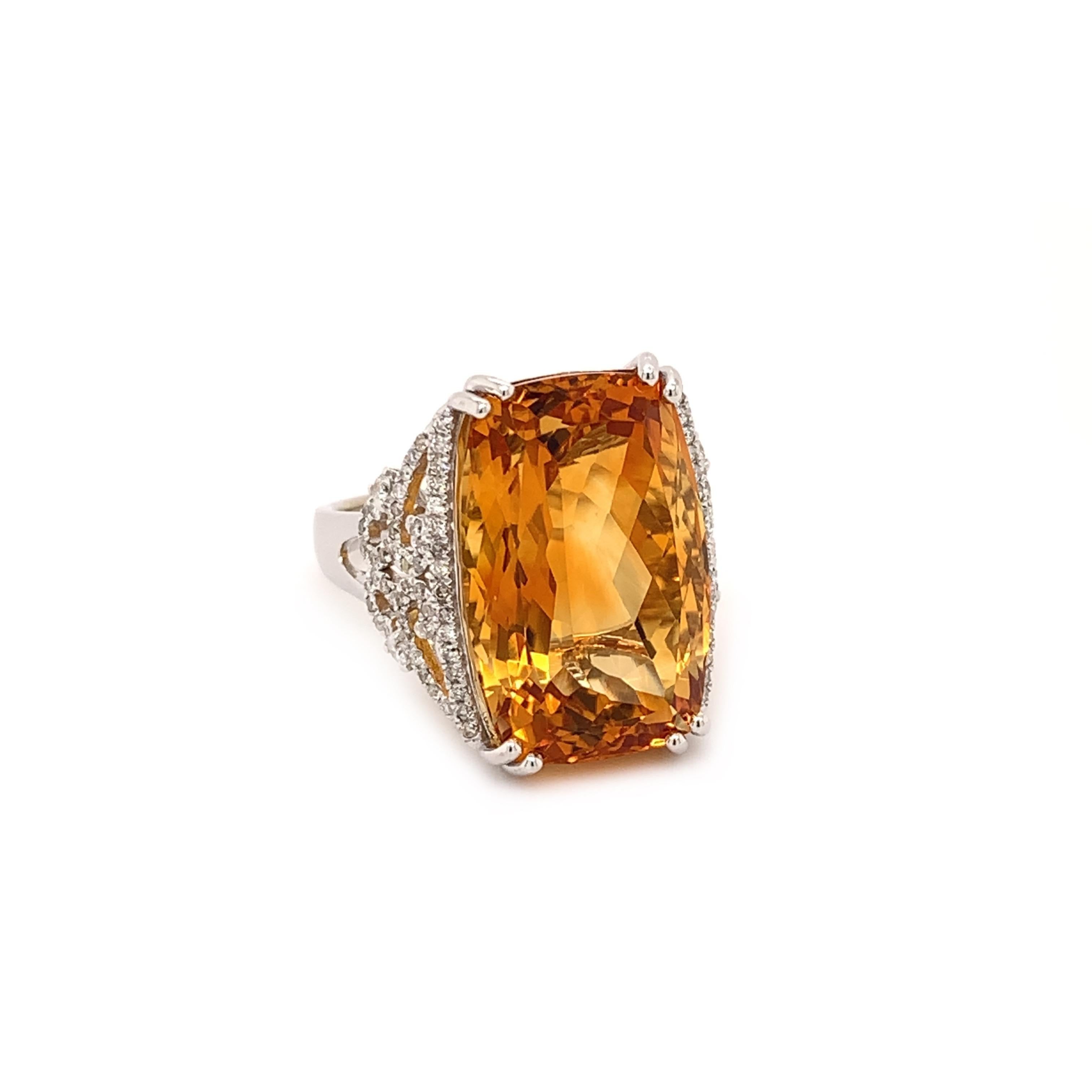 Stunning citrine diamond cocktail ring. High brilliance, deep golden honey tone, transparent clean, rectangular mix cut with diamond cut bottom, natural 14.60 carats citrine mounted in high profile open basket with eight bead prongs, accented with