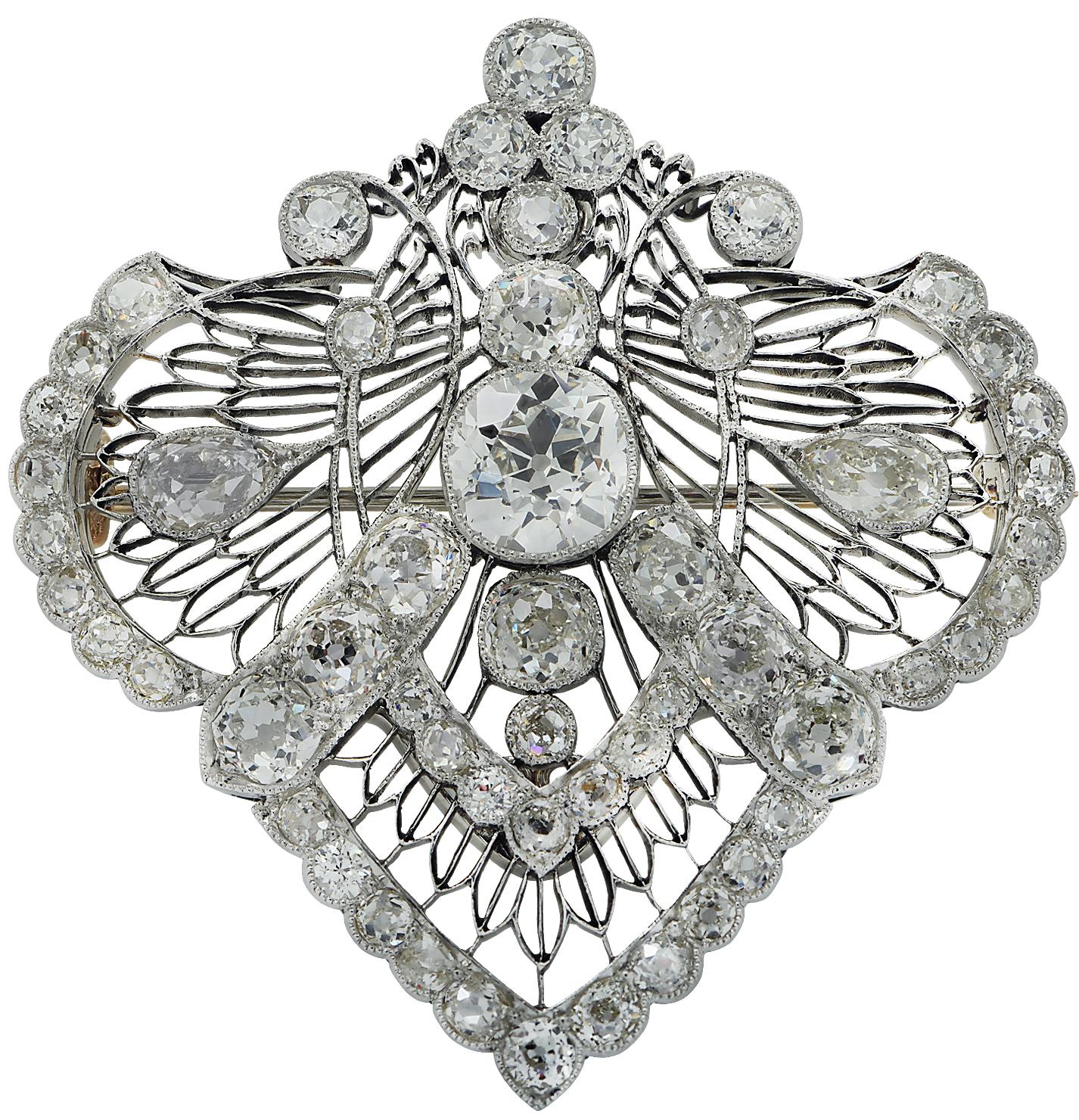 Beautiful Edwardian brooch pin/necklace intricately crafted in platinum and yellow gold showcasing 58 Old Miner Cut diamonds weighing approximately 14.60 carats total, H-I color, VS-SI clarity. The center Old Miner stone is certified by the GIA, and