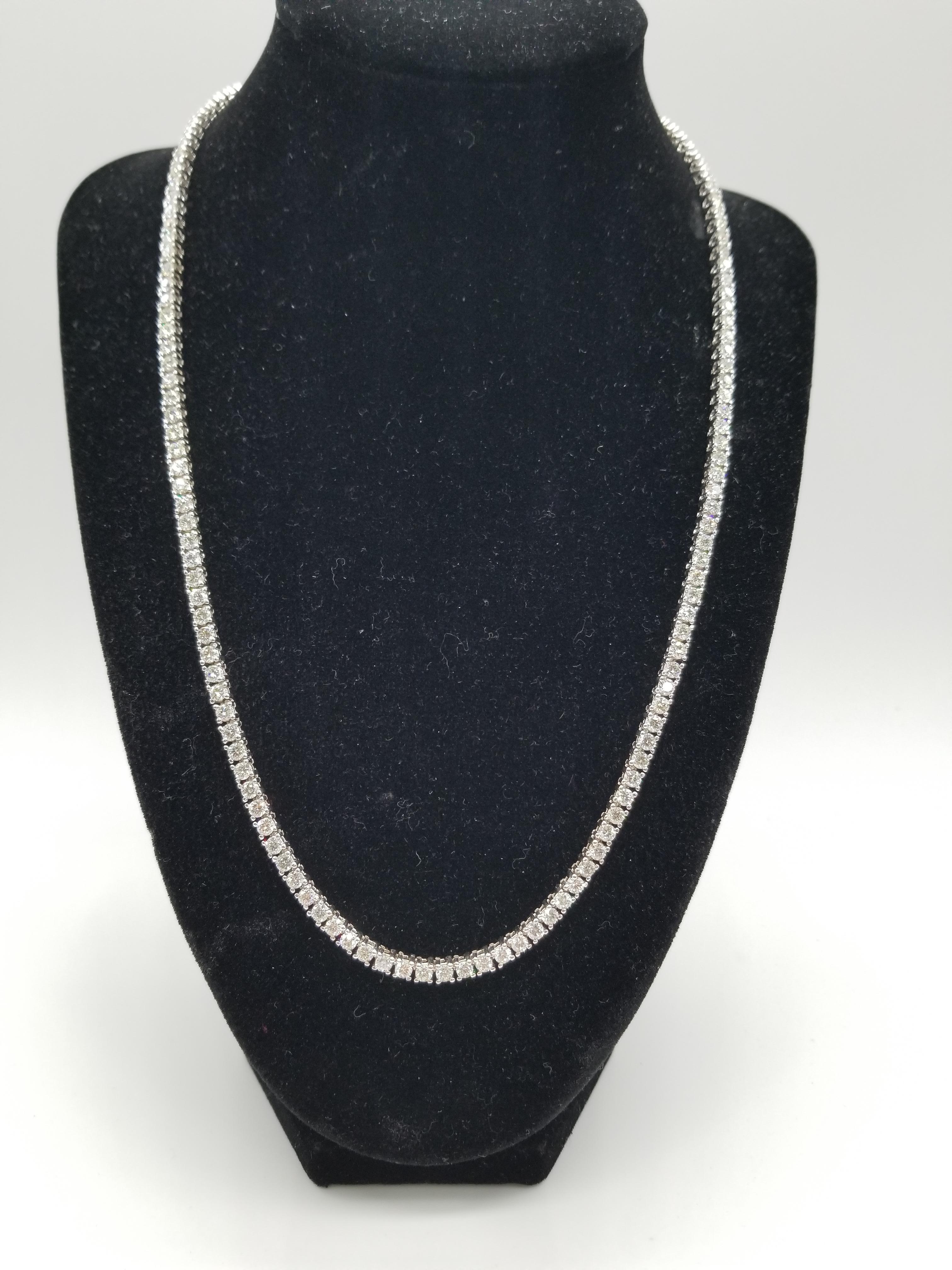 Elegantly simple. Beautiful jewelry 14 Karat White Gold Round Brilliant Cut Diamond Tennis Necklace set on 4 prong setting. The total diamond weight is 14.60carats. The closure is an insert clasp with safety clasp. Length is 20 inches. Average I