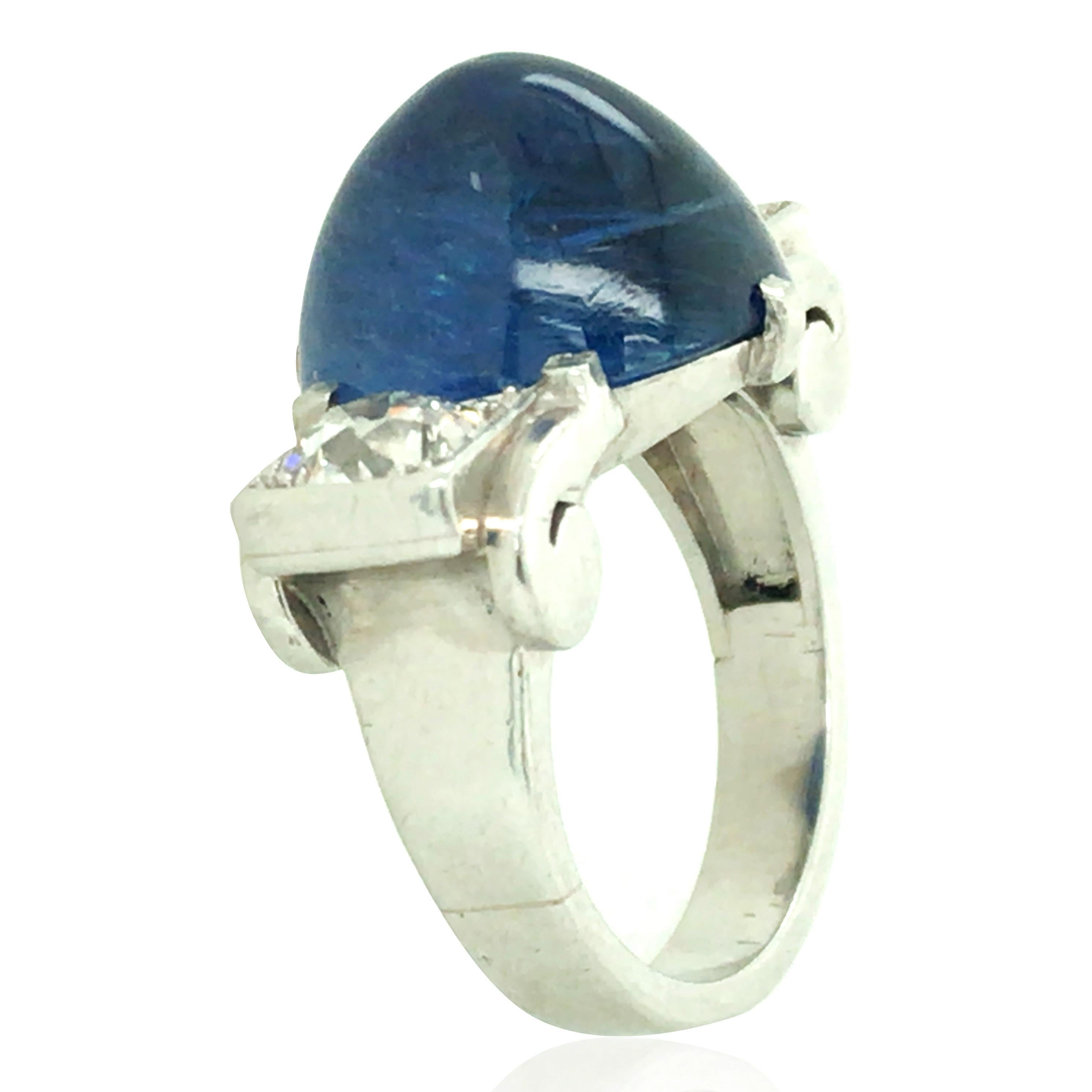 This ring consists of one 14.61ct cabochon-cut sapphire and two round-cut diamonds. Diamond approx. 1ct in total. Ring size: 5.75

Sapphire: 14.61ct
Diamond: 1.3ct
Weight: 13.4grams