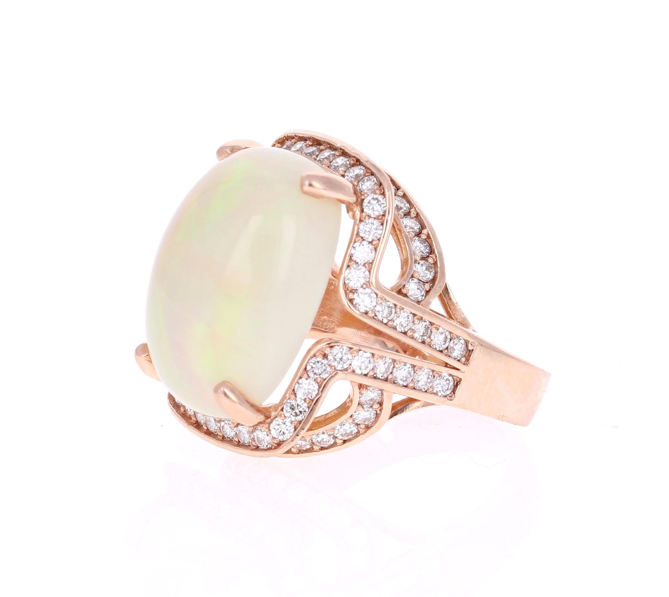 One Of A Kind Opulent Opal Diamond Ring! 

This ring has a 12.83 Carat Opal that is curated in a unique 14 Karat Rose Gold setting. The setting is adorned with 82 Round Cut Diamonds that weigh 1.80 Carats. The total carat weight of the ring is 14.63