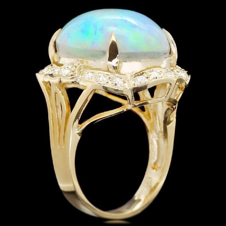 14.65 Carats Natural Impressive Ethiopian Opal and Diamond 14K Solid Yellow Gold Ring

The opal has beautiful fire, pictures don't show the whole beauty of the opal!

Total Natural Opal Weight is: Approx. 14.00 Carats

Opal Measures: 18.00x