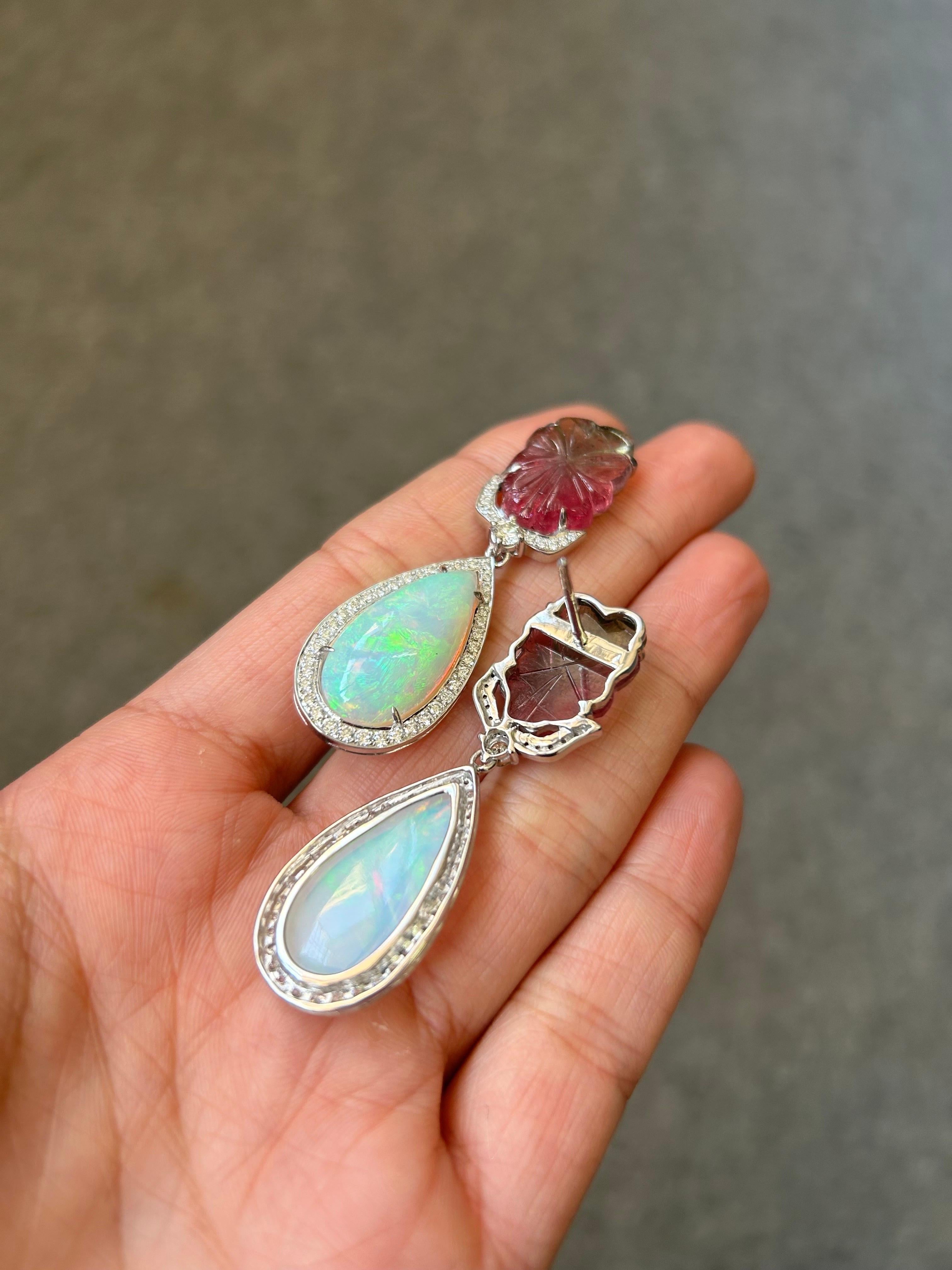 A beautiful combination of 14.66 carat bi-color Tourmaline and 16.55 Ethiopian Opal, with 1.13 carat Diamond set in solid 18K White Gold. Comes with push-pull backing. 
 