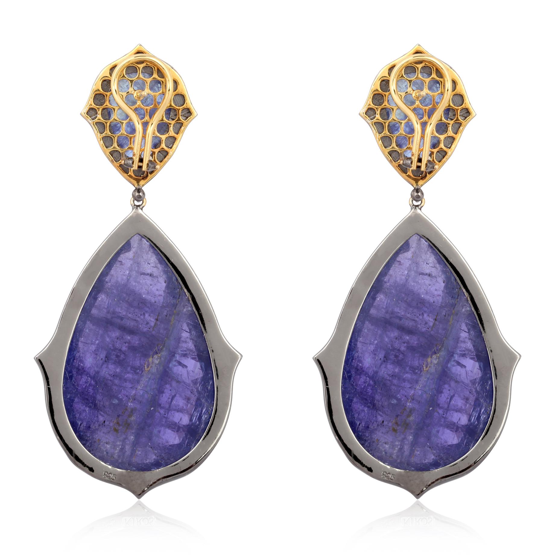 Cast in 18-karat gold & sterling silver, these stunning drop earrings are set with 146.9 carats tanzanite and 2.06 carats of sparkling diamonds. 

FOLLOW  MEGHNA JEWELS storefront to view the latest collection & exclusive pieces.  Meghna Jewels is