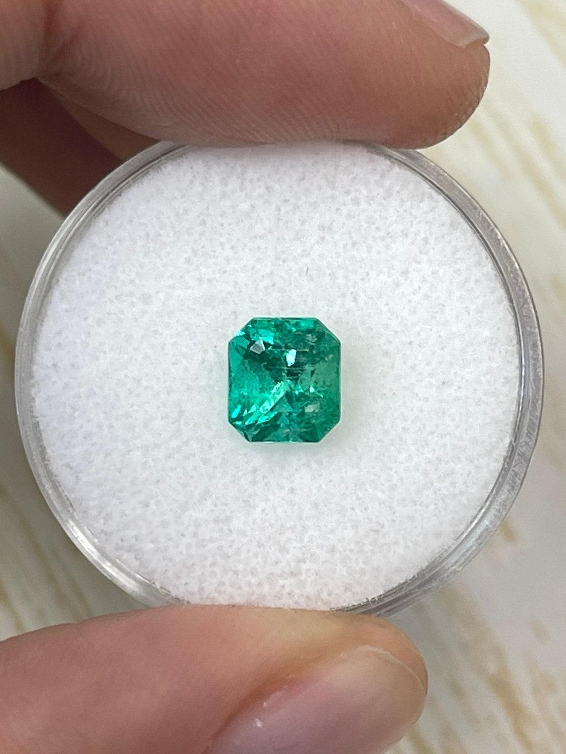Stone: Emerald
Weight: 1.46-carats
Shape: Emerald Cut
Clarity: Transparent
Luster: Excellent
Color: Bluish Green
Measurements: 6.77mm x 6.44mm x 5.38mm
Geographic Origin: Colombia
Treatment: Natural, Oiling

Comments: Due to their growth conditions