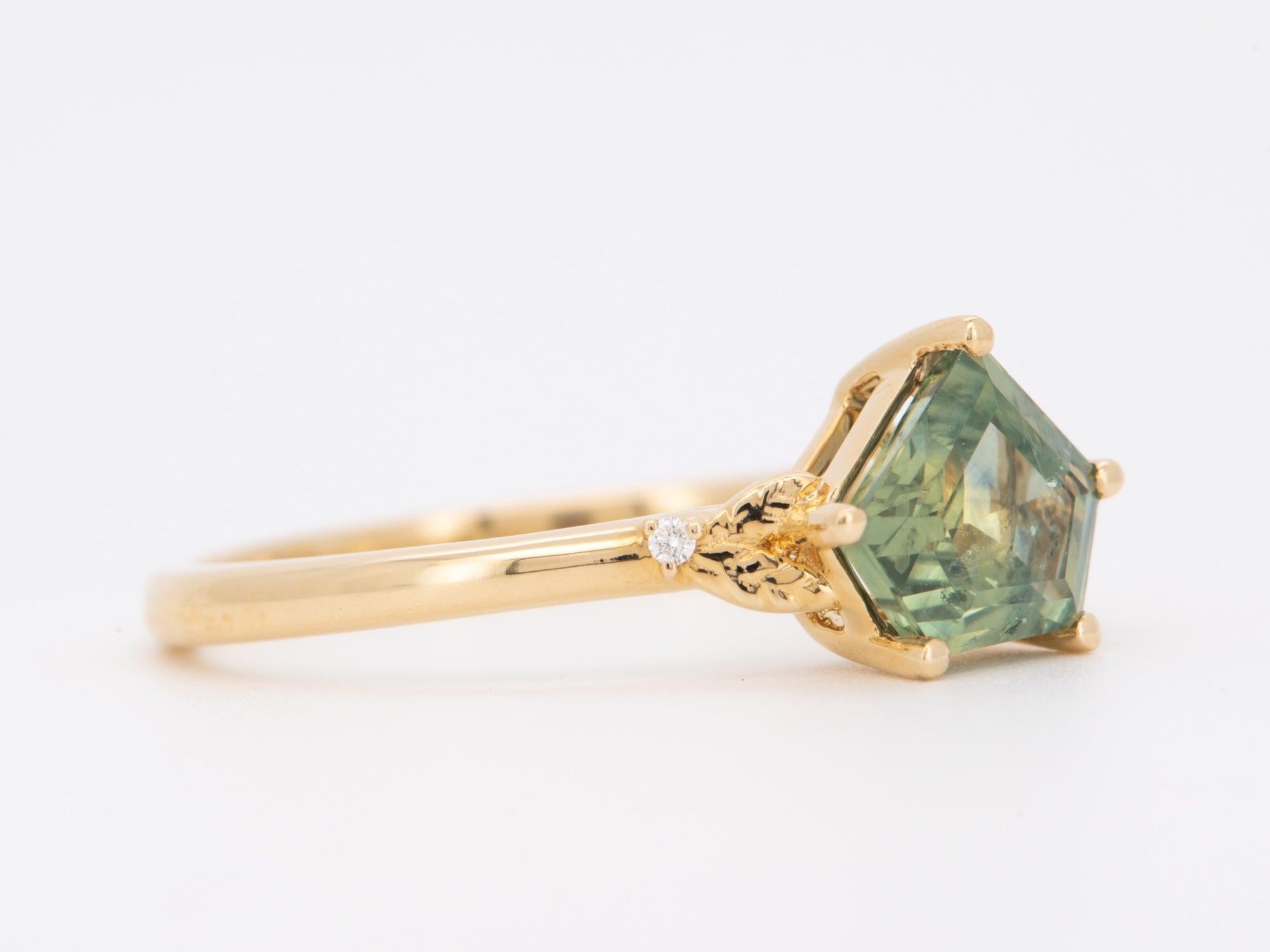 ♥ 1.46ct Shield Shape Montana Sapphire with Leaf Design Ring 14K Gold R6754
♥ The item measures 7.7mm in length (North South direction), 12.7mm in width (East West direction), and stands 5.6mm from the finger

♥ US Size 7 (Free resizing up or down 1