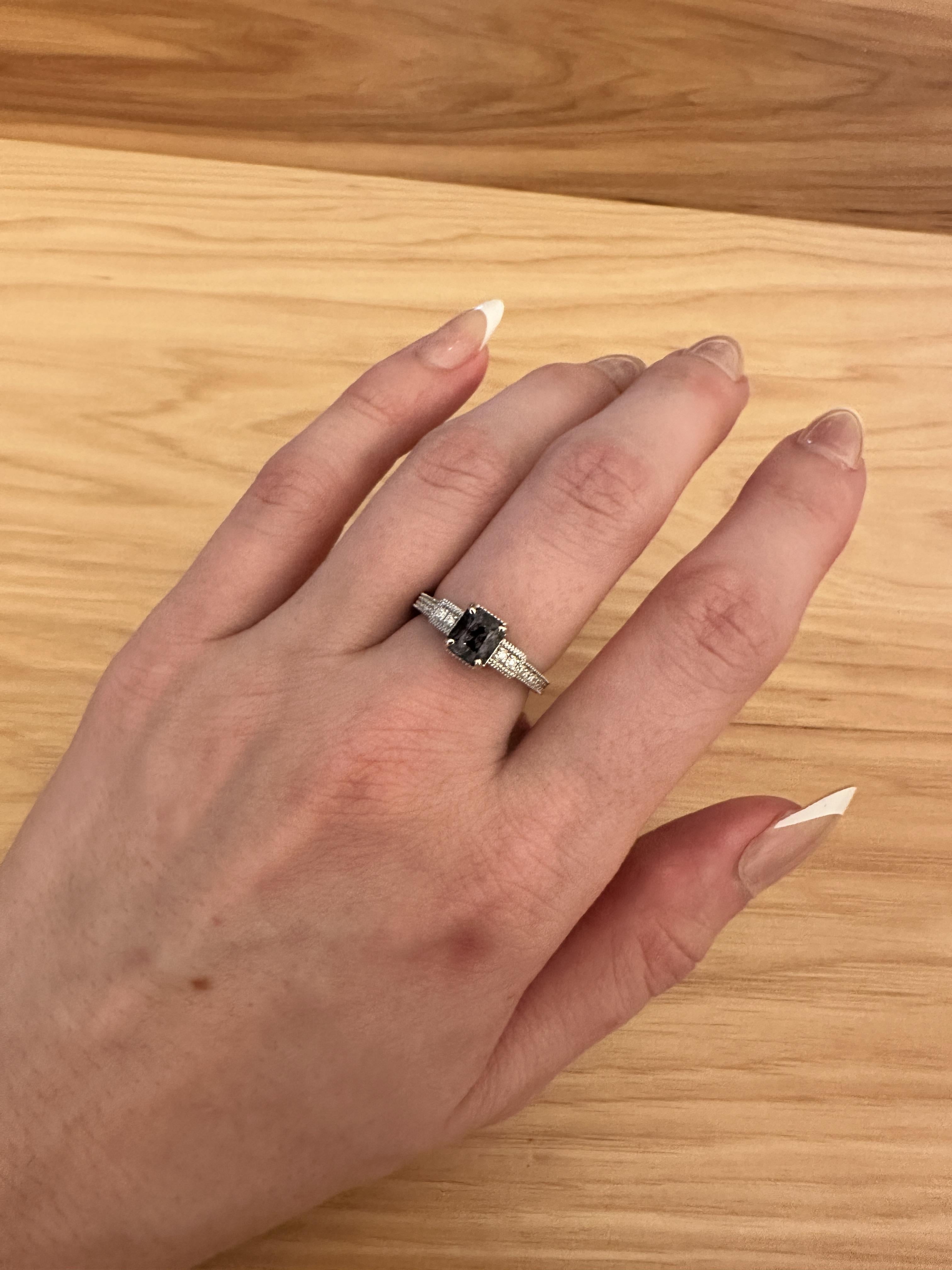 This elegant ring features a 1.46ct natural spinel and sparkling diamond accents. The milgrain details add a touch of sophistication to this August birthstone ring, making it the perfect choice for an engagement or special occasion.

**We offer