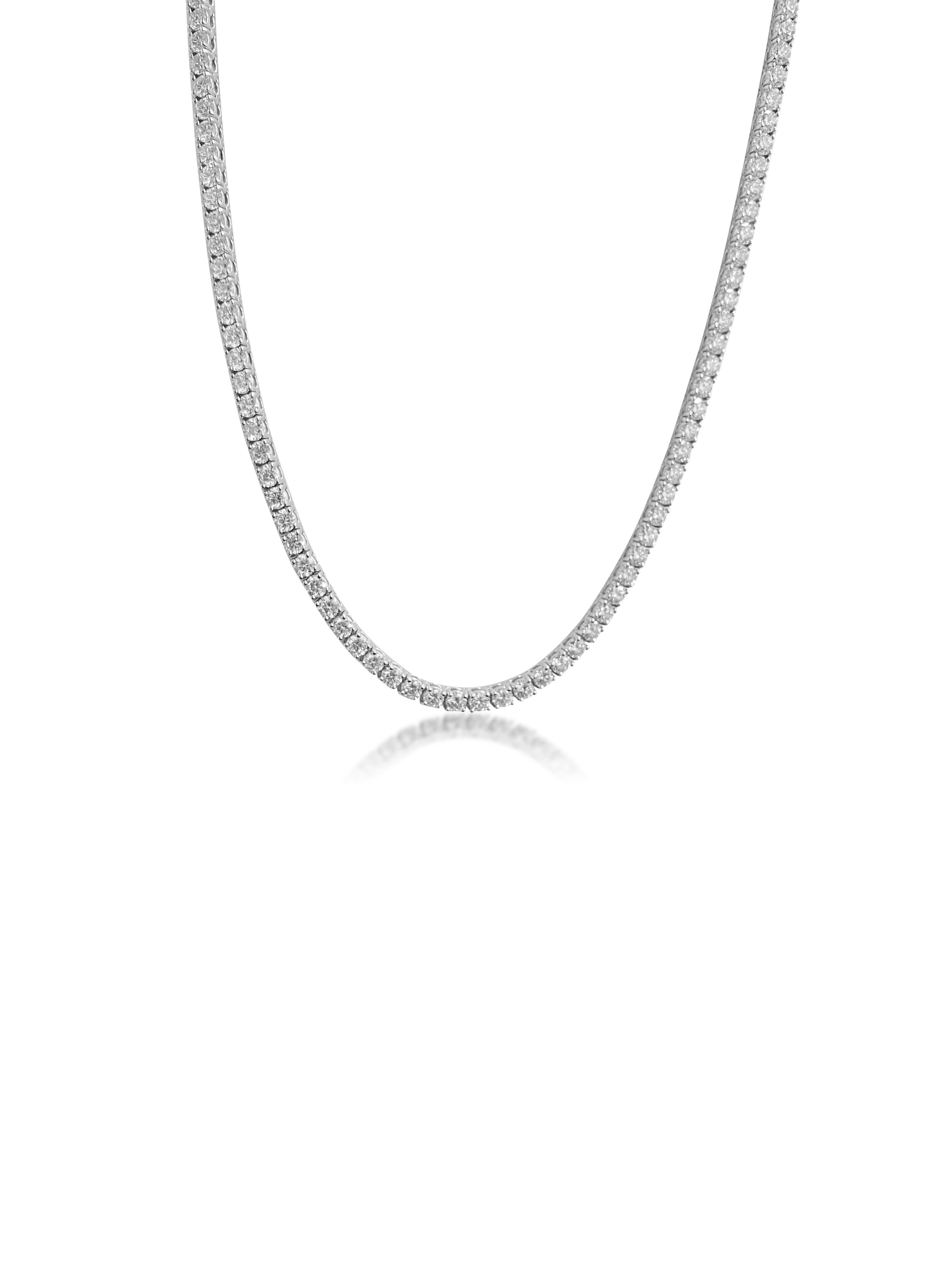 Fashioned from luxurious 14K white gold, this stunning necklace features 14.5 carats of round brilliant cut diamonds, showcasing VVS clarity and unparalleled brilliance. With a length of 17 inches, this exquisite piece exudes elegance and
