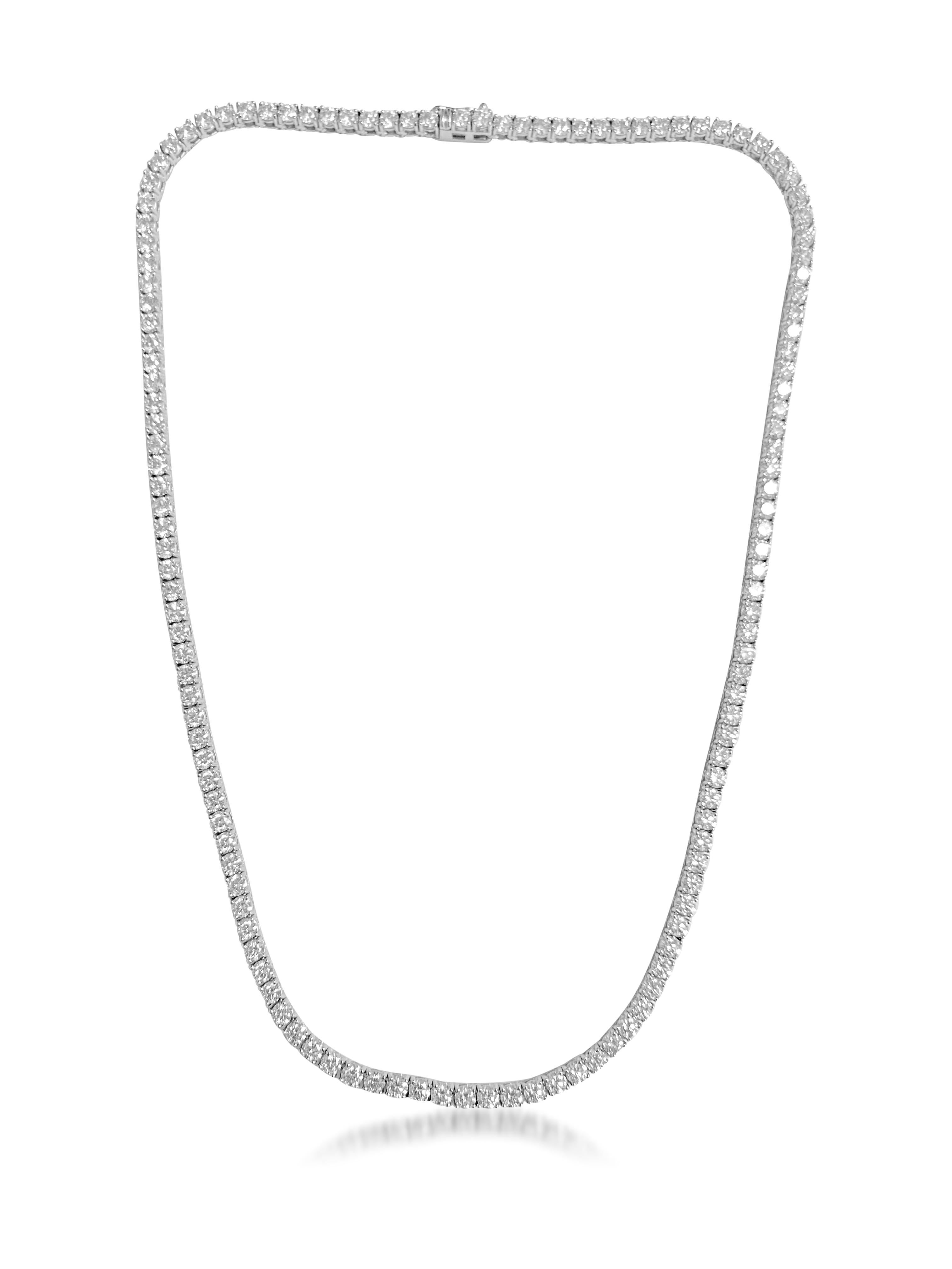 Fashioned from luxurious 14K white gold, this stunning necklace features 14.5 carats of round brilliant cut diamonds, showcasing VVS clarity and unparalleled brilliance. With a length of 17 inches, this exquisite piece exudes elegance and
