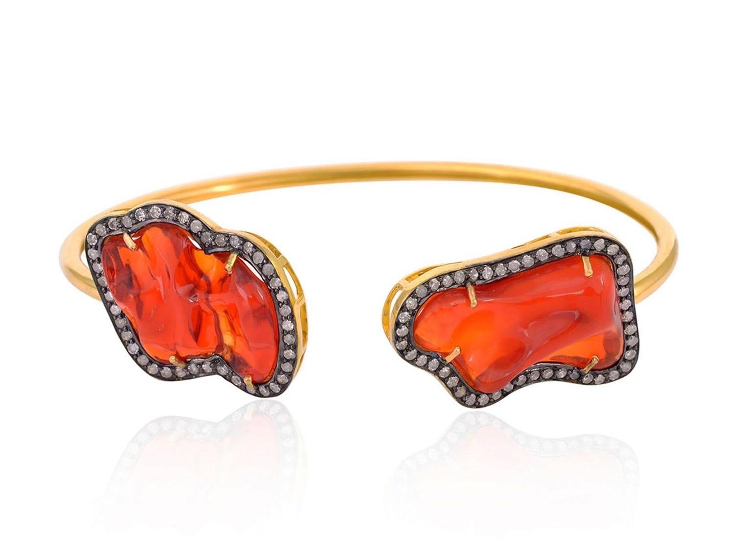 Beautifully crafted from 18-karat yellow gold & sterling silver.  It has an open silhouette that's tipped with 14.7-carats fire opal and .87 carats diamonds in blackened finish.

FOLLOW  MEGHNA JEWELS storefront to view the latest collection &