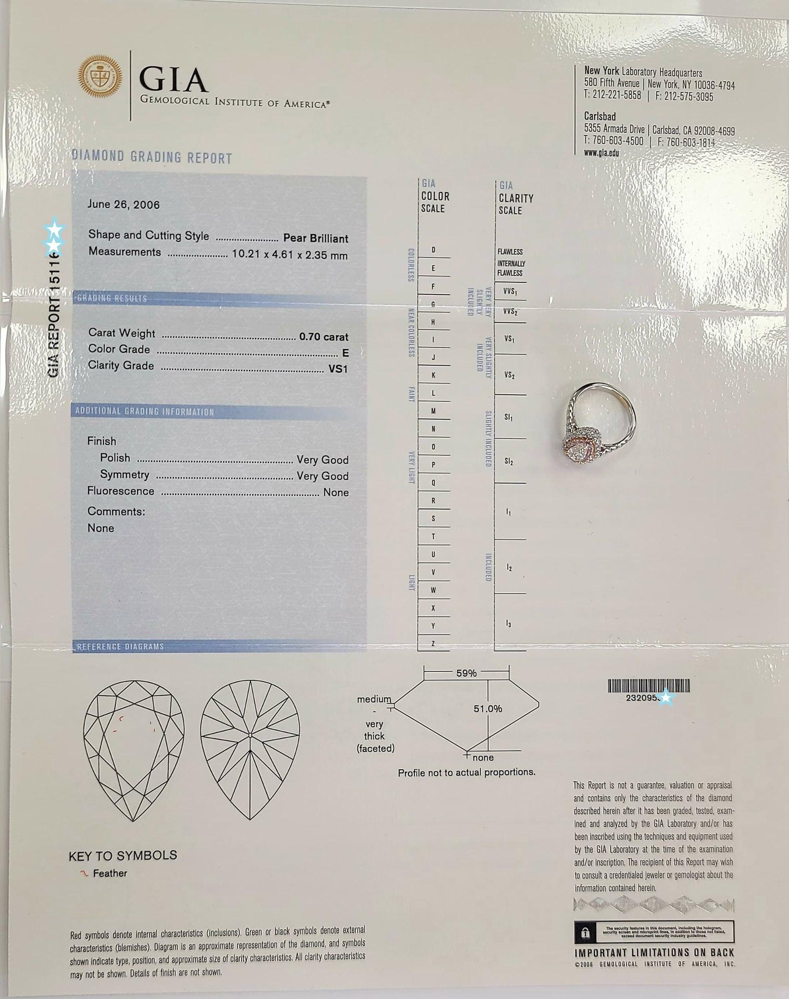 Pear cut diamond weighing 0.70 ct, E in color, VS1 in clarity set in 18 karat white gold. This ring has an inner rose gold halo with 0.22 ct diamonds. The outer halo has 0.55 round brilliant diamonds. GIA certificate.

Details: 

metal: 18k white