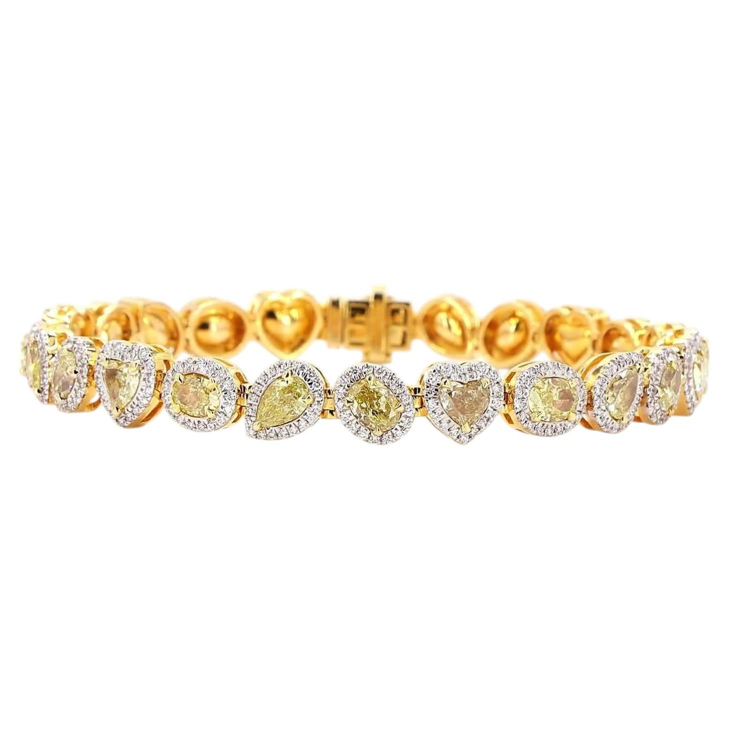 Armband aus Gold mit einem weißen Diamanten im Rundbrillantschliff von 1.47 Karat und einem gelben Diamanten