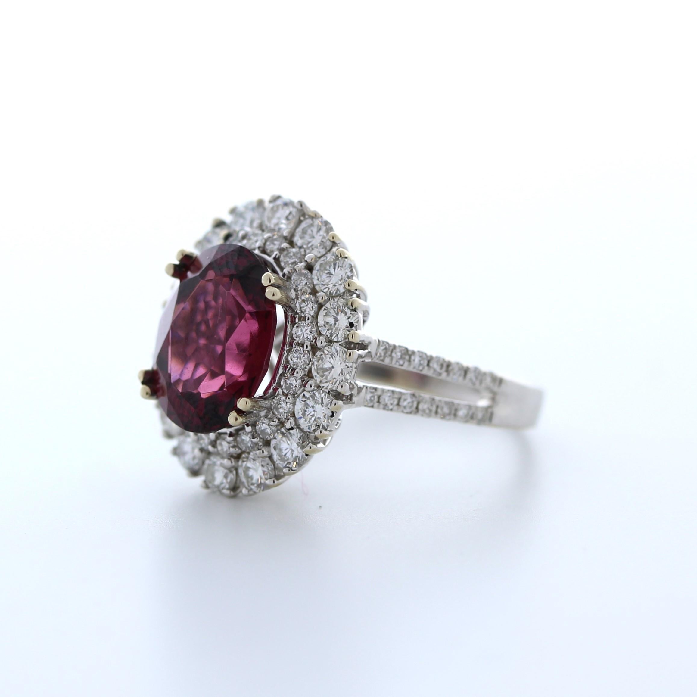 This stunning 1.47 carat weight reddish pink garnet fashion ring is a bold and beautiful choice for any occasion. The garnet is a rich shade of reddish pink and boasts exceptional clarity and brilliance, weighing in at 1.47 carats. It is set in