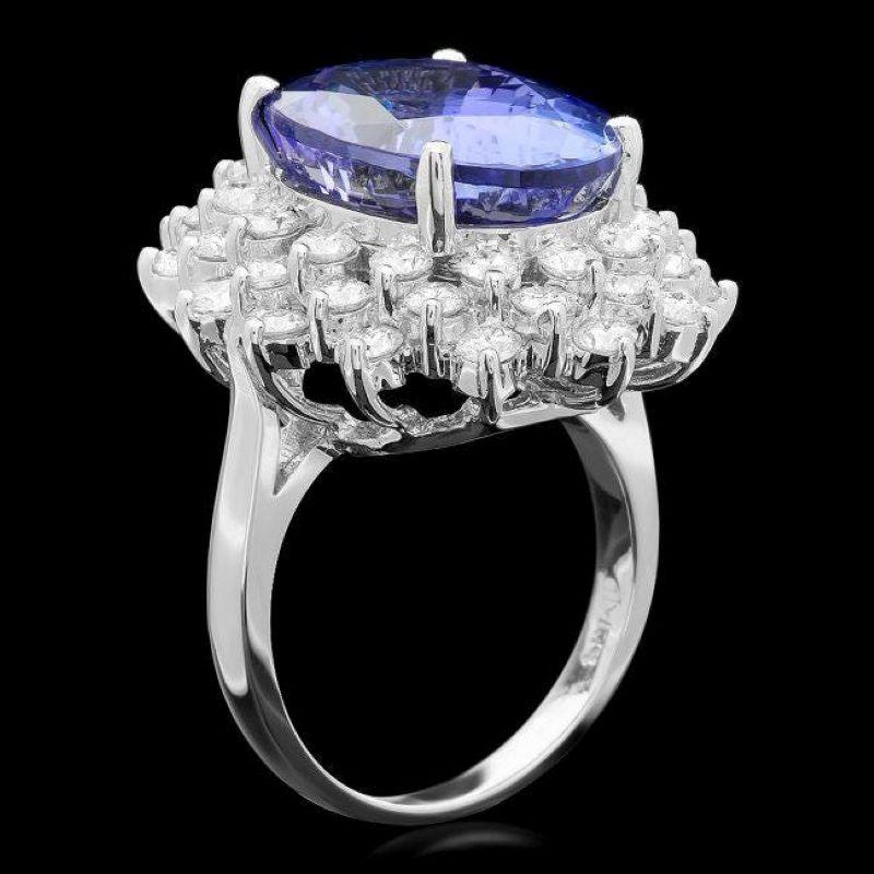 14.70 Carats Natural Very Nice Looking Tanzanite and Diamond 14K Solid White Gold Ring

Total Natural Oval Cut Tanzanite Weight is: Approx. 12.30 Carats 

Tanzanite Measures: Approx. 16.00 x 12.00mm

Natural Round Diamonds Weight: Approx. 2.40