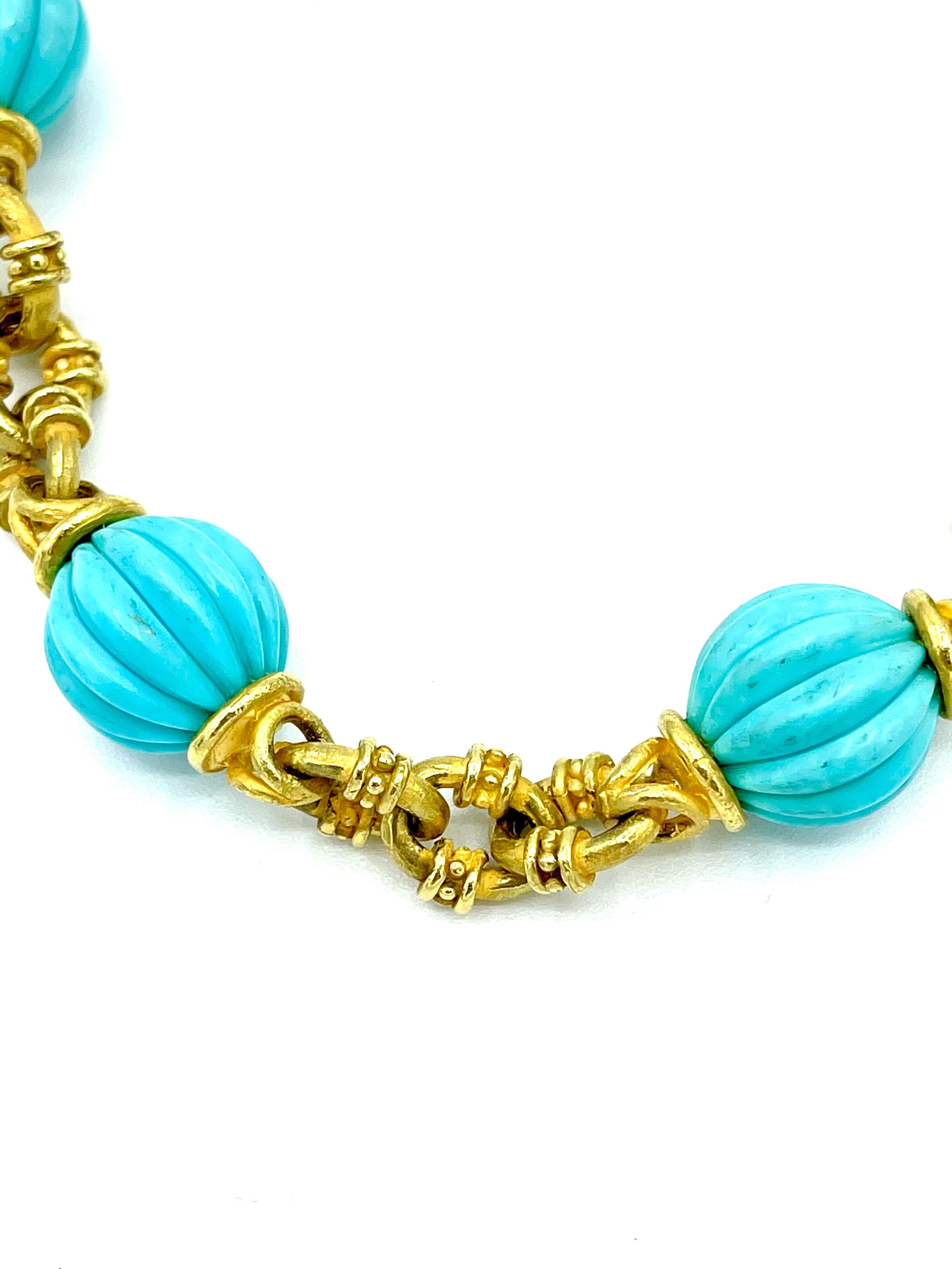 The perfect necklace to wear all the time!  This 25.00 inch necklace features 14.70mm carved ribbed turquoise beads with a beautifully handcrafted matte finish 18K yellow god link.  There are 12 turquoise beads throughout with three links between