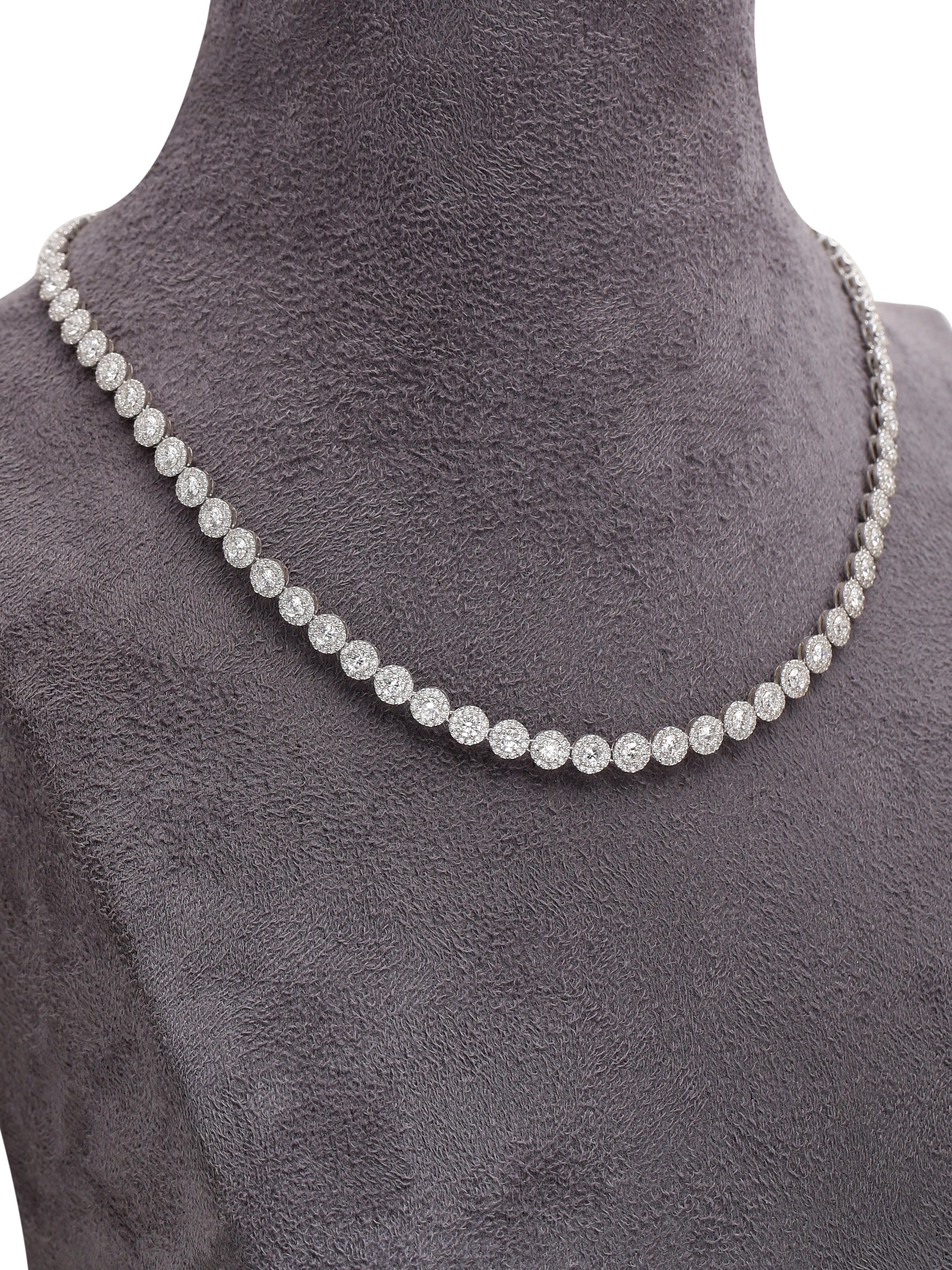 A beautiful evergreen diamond necklace made with fine quality diamonds set together in a cluster to give a grand look. The Necklace is a timeless piece and because of the elegant design can be worn by women all ages. 
Its a piece worthy of being in