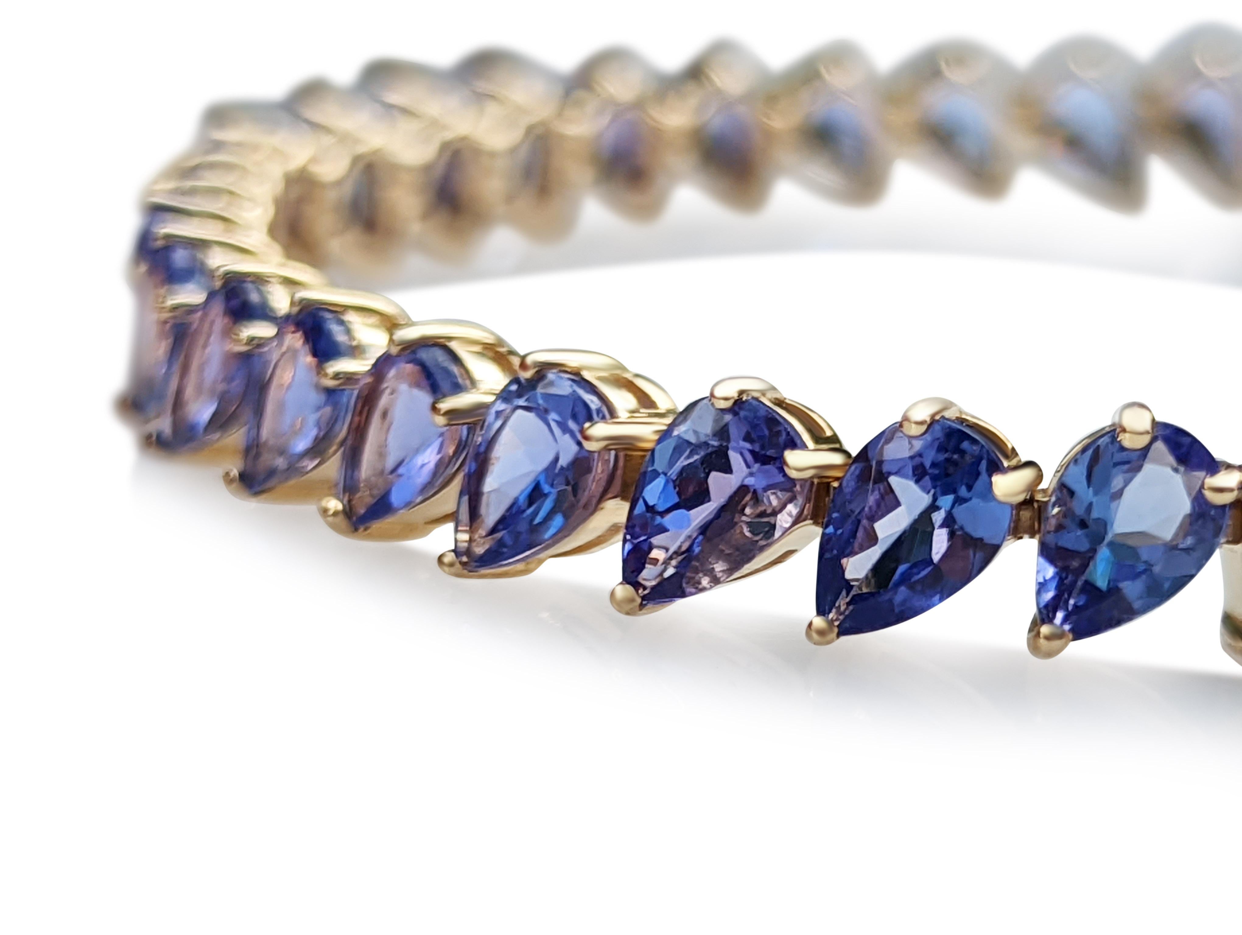 A truly one of a kind natural Tanzanite bracelet, set with 40 pear mixed cut tanzanite stones of 14.75 total carat weight!
The bracelet will stand out in any occasion and is a wonderful gift for yourself or your loved one.
Only 1 in stock - NO