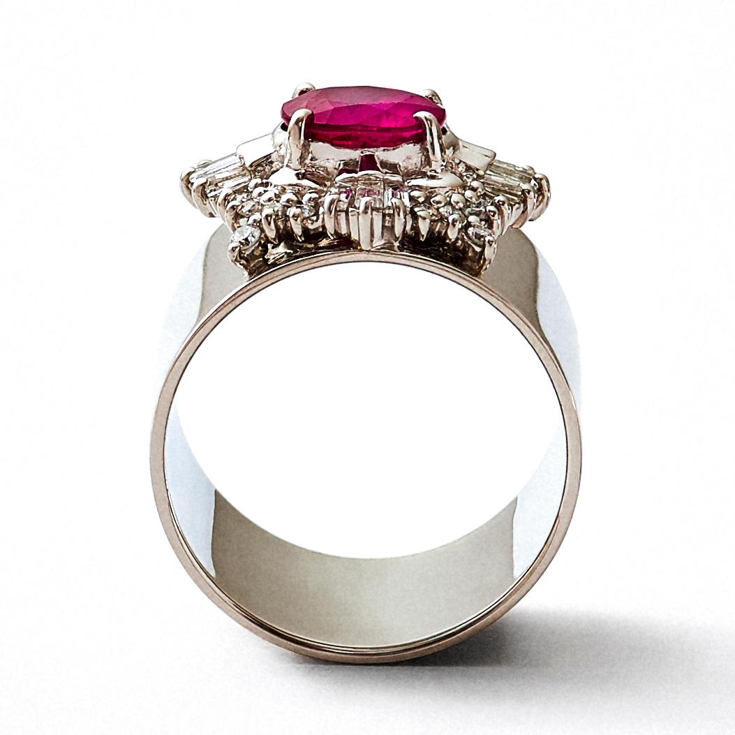 This is a luxurious, one-of-a-kind platinum cocktail ring that combines a repurposed vintage high jewelry stone setting with a wide ring band. This rare and classic setting was made by highly skilled craftsmen and features an oval cut ruby in a four