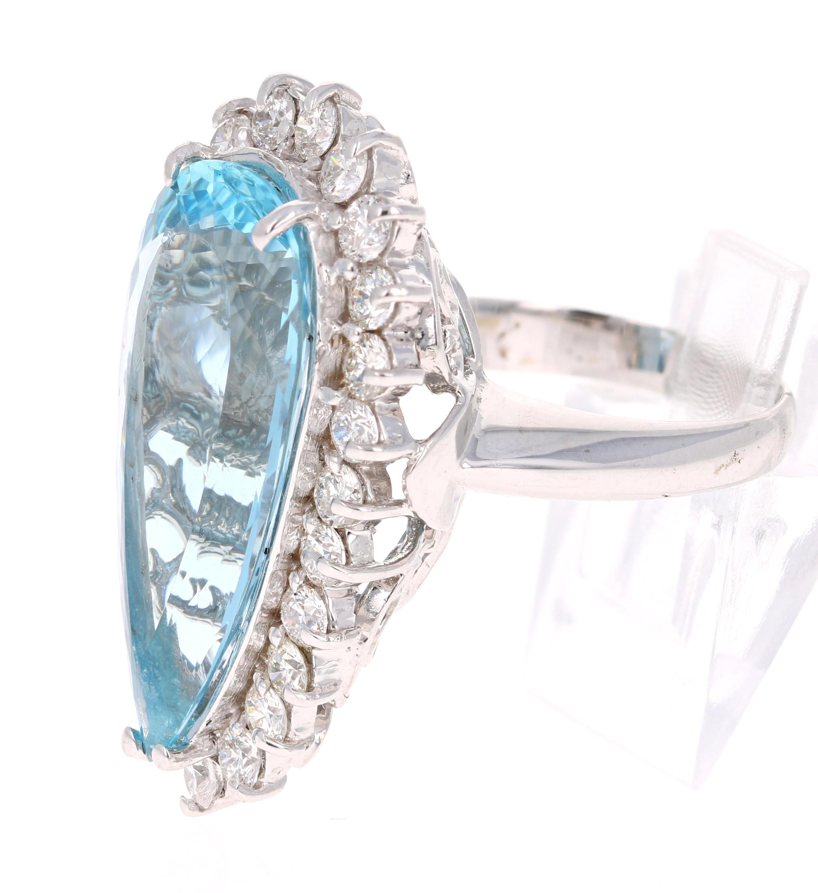 Stunning masterpiece!!!! 
This ring has a GORGEOUS 12.82 carat Pear Cut Aquamarine set in the center of the ring and is surrounded by 24 Round Cut Diamonds that weigh 1.95 carat (Clarity: SI2, Color: F). The total carat weight of this ring is 14.77