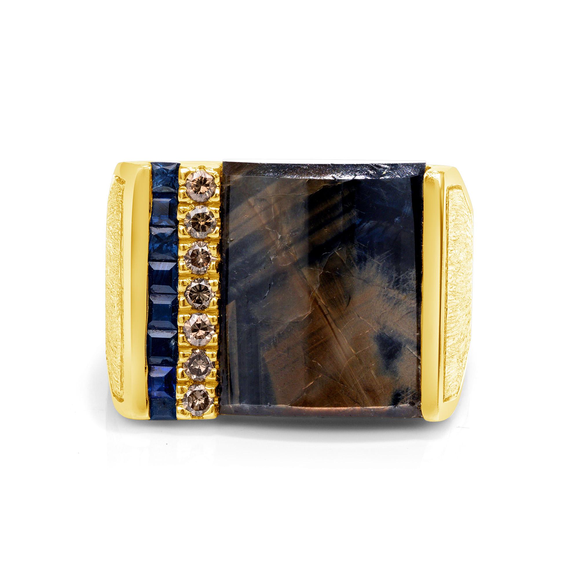 14.77 Carat GoldSheen Sapphire Diamonds Blue Sapphire Yellow Gold Men's Ring, In Stock.

This Goldsheen Sapphire men's ring requires no treatments. 
The biggest stone on the ring is a 14.77-carat Goldsheen Sapphire. 
It was hand fabricated in