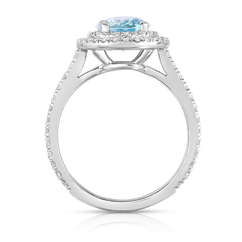 Modern 1.47ct. Oval Aquamarine Conflict Free Diamond Platinum Halo Cocktail Ring For Sale