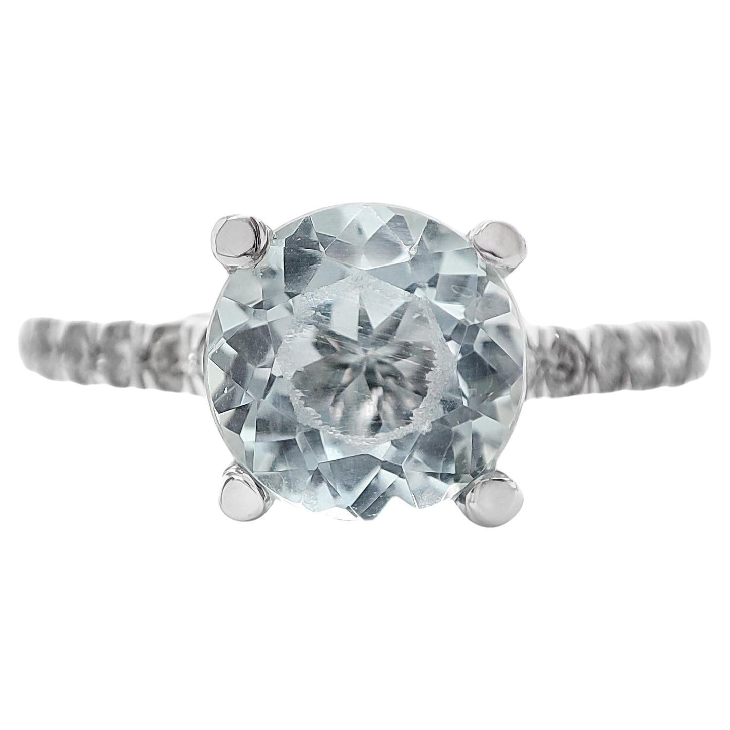 FOR US BUYER NO VAT

This exquisite piece features a natural blue aquamarine with a total weight of 1.25 carats, taking center stage with its serene and captivating blue hue.

Complementing the aquamarine are 12 diamonds, totaling 0.23 carats. These