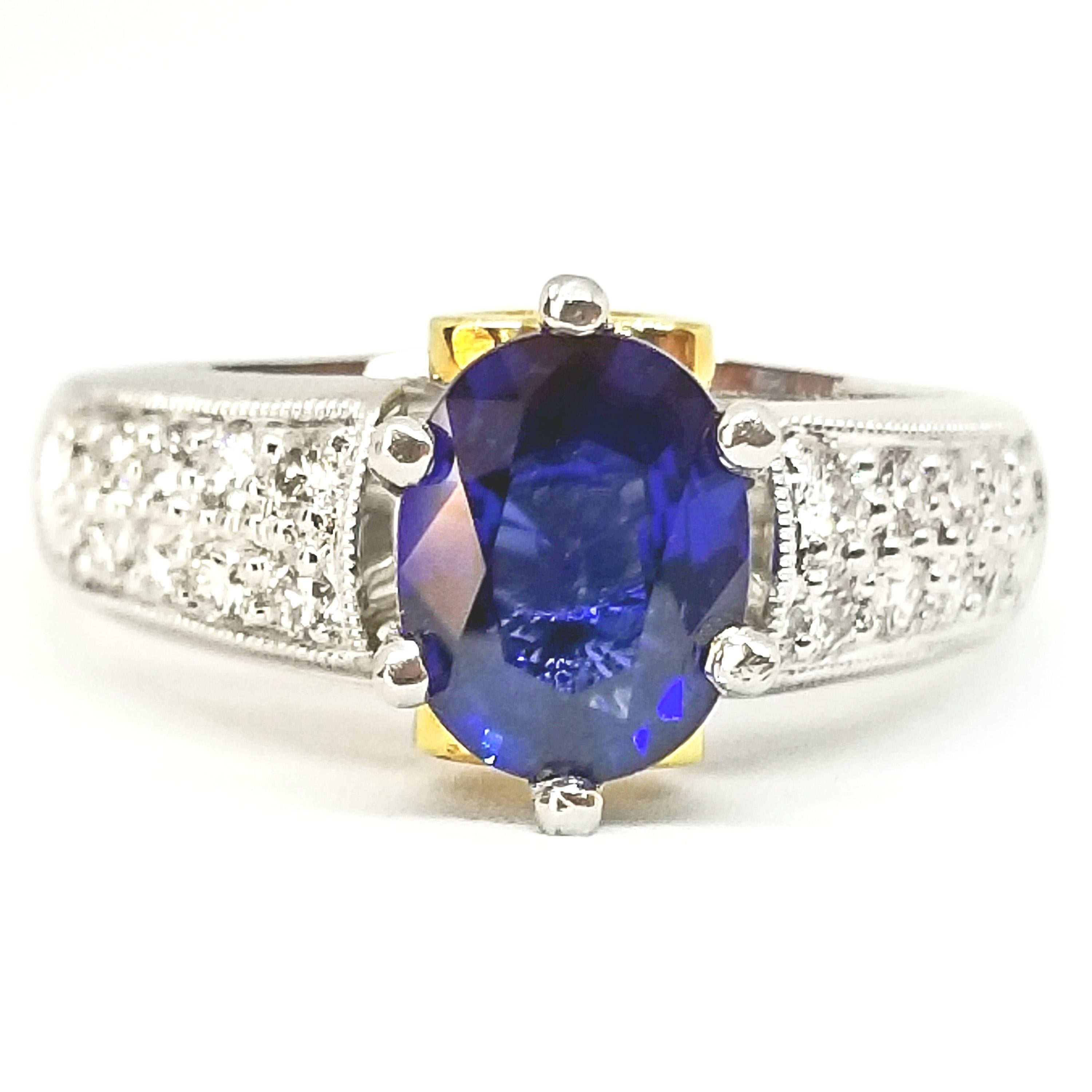 A Contemporary Engagement or Cocktail Ring is set with a 1.48 Carat Oval Brilliant Cut Blue Ceylon Sapphire of Medium Blue Hue and Fine Gem Quality. The stone is prong set in a Diamond Mounting Crafted in Platinum with 18K Yellow accents. The