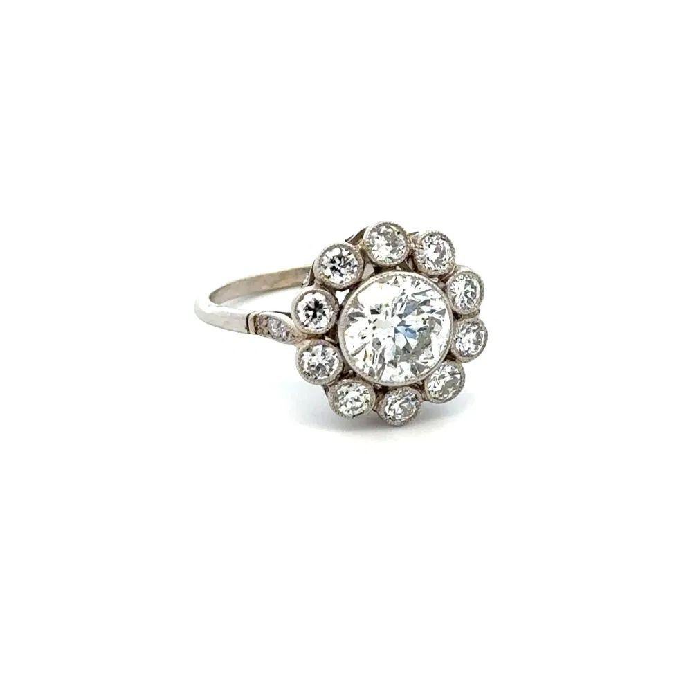 Simply Beautiful! Diamond and Platinum Statement Cocktail Ring. Centering a securely nestled Hand set 1.48 Carat Transitional Diamond. Surrounded by Old European Cut Diamonds, weighing approx. 1.20tcw. The ring is skillfully encased in Hand crafted