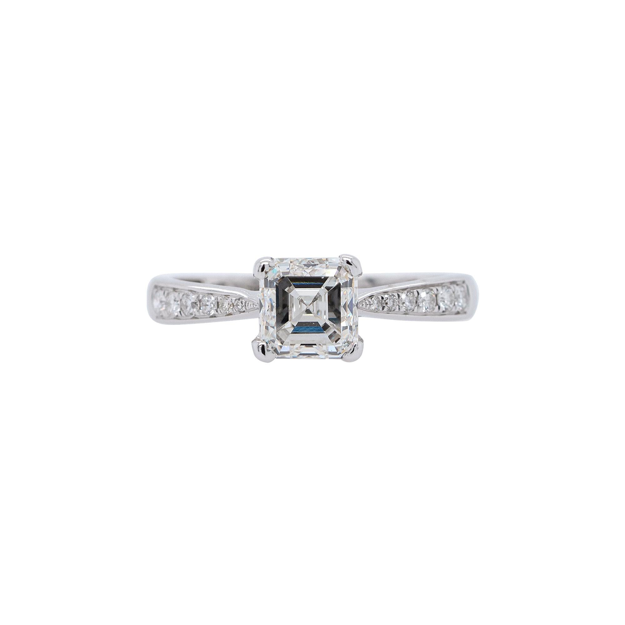 Embrace everlasting love with this exquisite 18k White Gold Engagement Ring featuring a mesmerizing GIA 1.48ct Emerald Cut Natural Diamond at its center. Adorned with 0.50ctw of dazzling round cut diamonds, this sophisticated masterpiece exudes