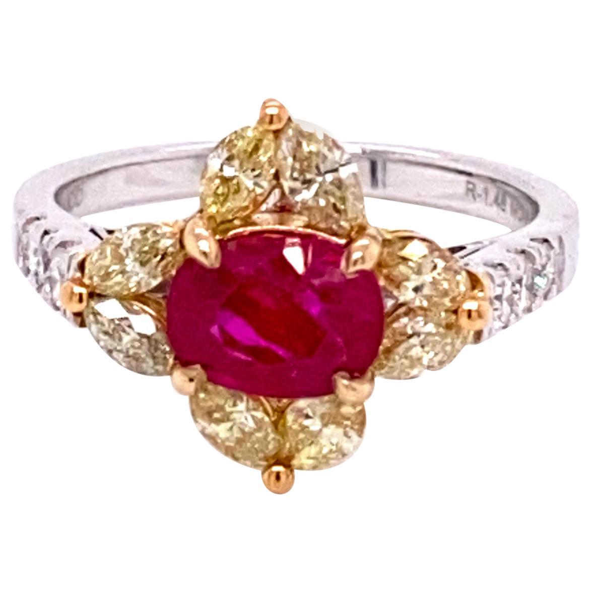 1.48 Carat GRS Certified No Heat Pigeon's Blood Red Burma Ruby and Diamond Ring:

A beautiful and rare ring, it features an exquisite GRS Lab certified no heat pigeon's blood red Burmese ruby weighing 1.48 carat with a flowery halo of fancy yellow