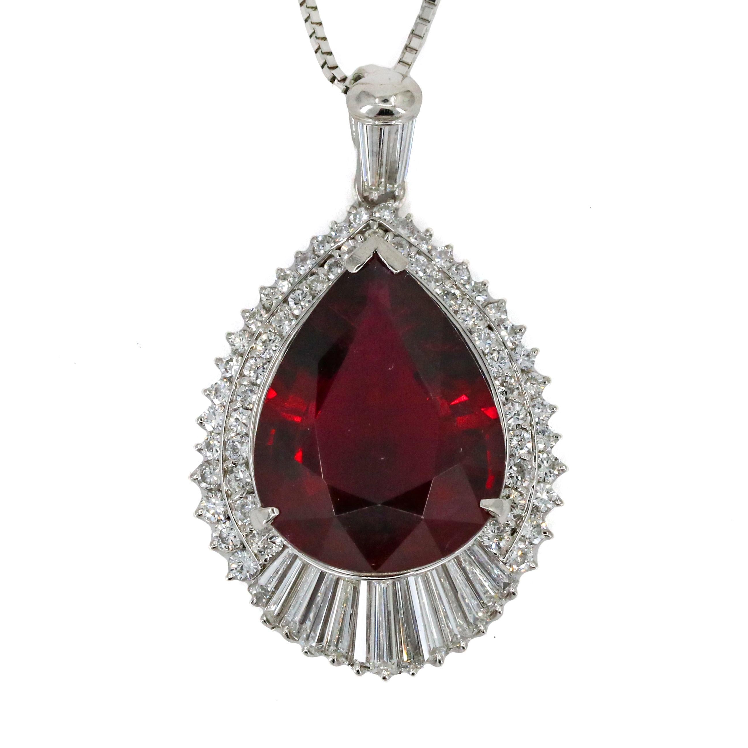 Rubellite Tourmaline and diamond pendant necklace in platinum. The pendant has a large pear-cut rubellite at the center that weighs 14.80 carats surrounded by numerous near colorless baguette and round cut diamonds. Adjustable box chain. 

Length,