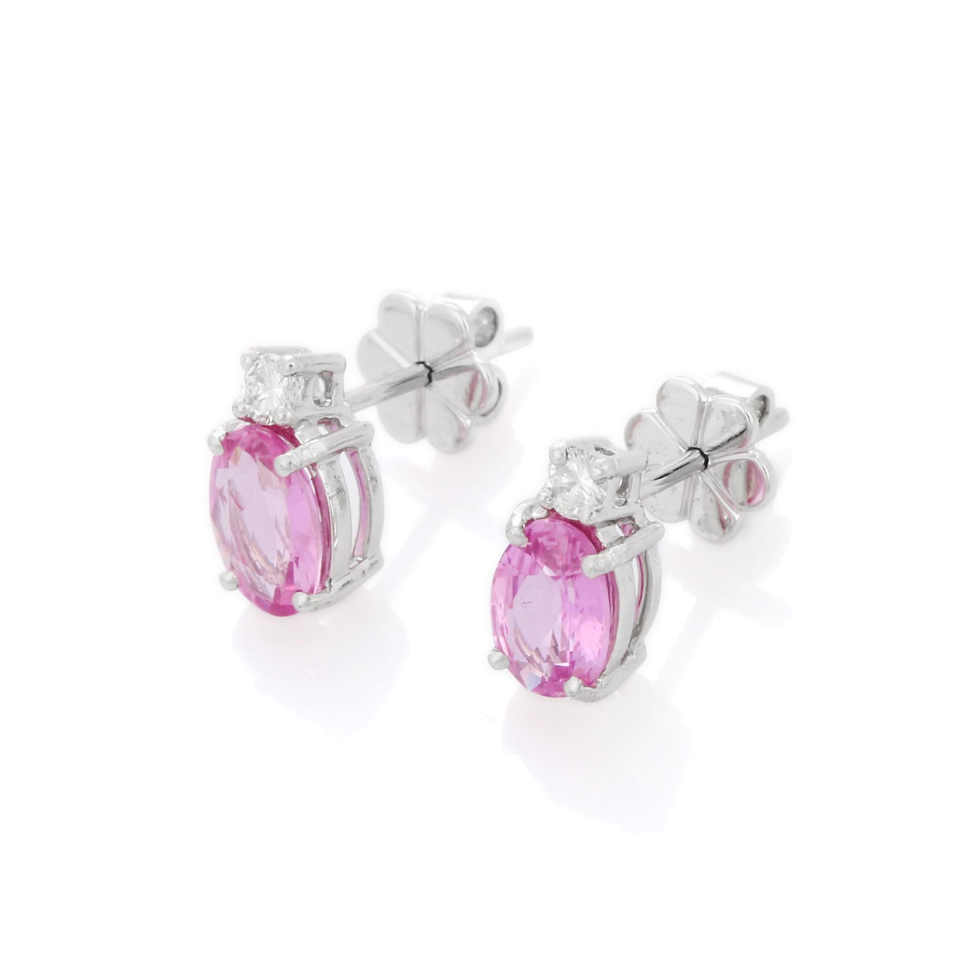 Studs create a subtle beauty while showcasing the colors of the natural precious gemstones and illuminating diamonds making a statement.

Oval cut pink sapphire studs with diamonds in 18K gold. Embrace your look with these stunning pair of earrings
