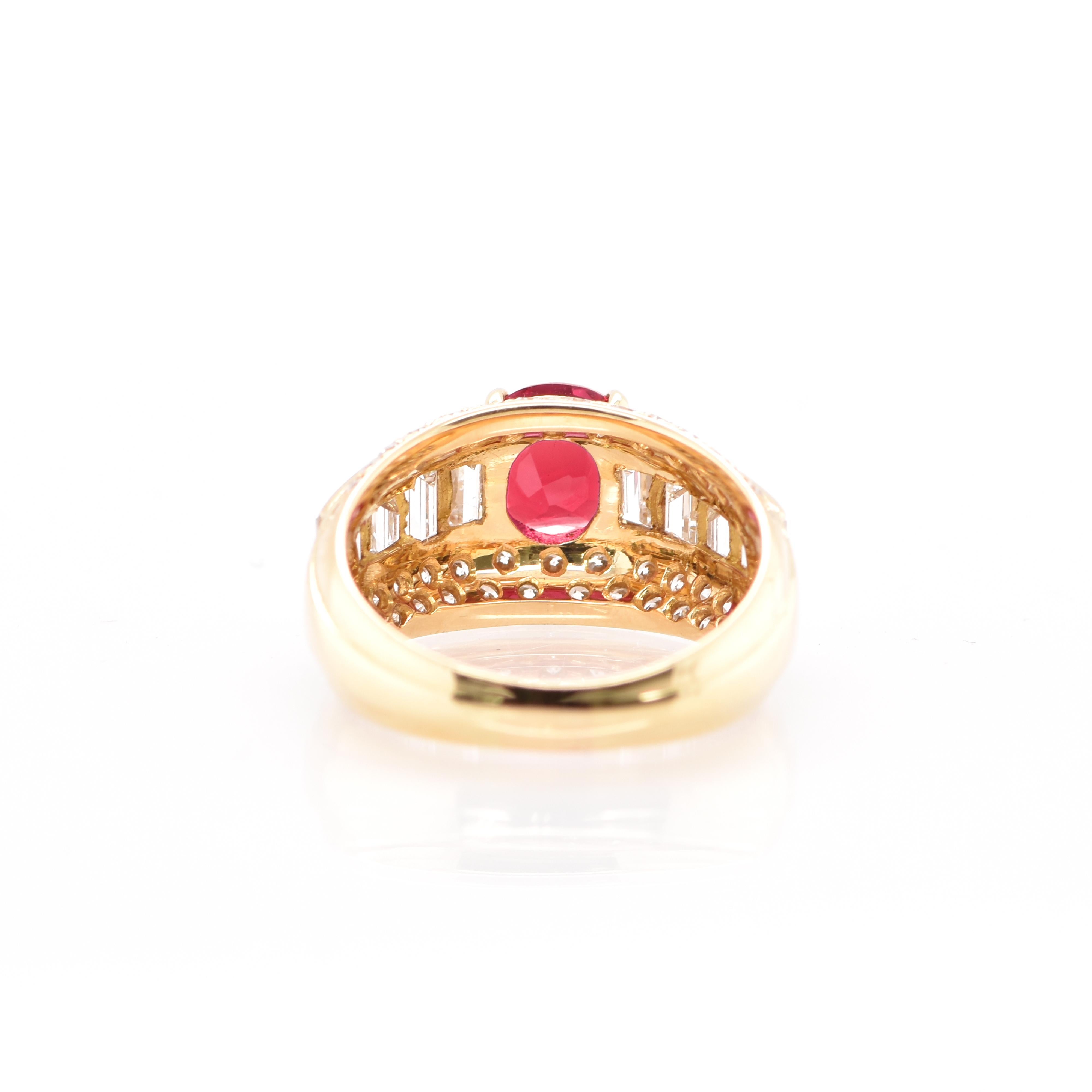A beautiful Band Ring featuring a 1.48 Carat Ruby and 2.01 Carats of Diamond Accents set in 18K Yellow Gold. The center Ruby exhibits very good color and luster. Rubies are referred to as 