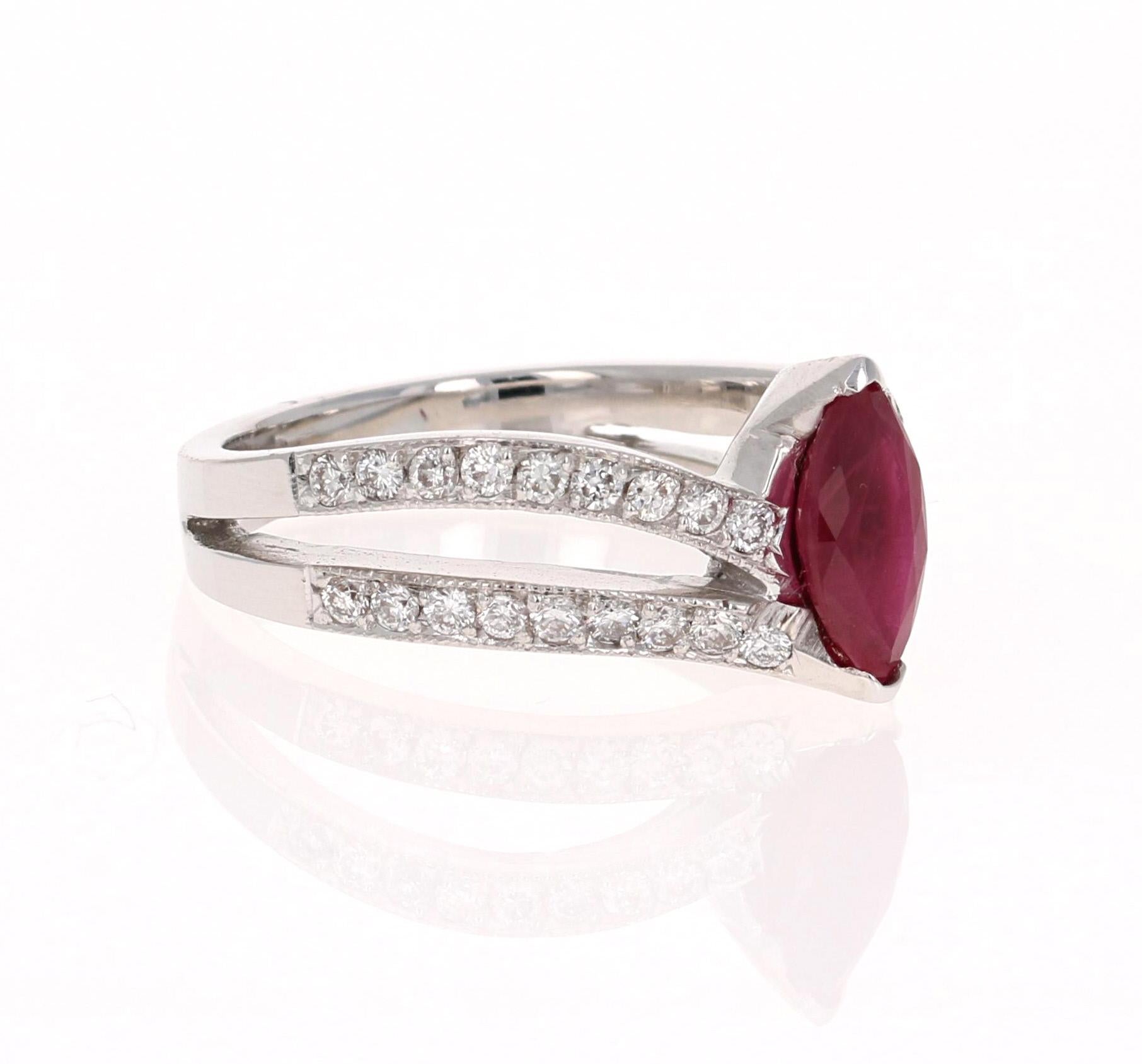 
There is a beautiful Marquise cut Mozambique Ruby set in the center of the ring that weighs 0.93 carats and there are 36 Round Cut Diamonds that weigh 0.54 carats (Clarity: VS2, Color: F).  The total carat weight of the ring is 1.48 carats.  This