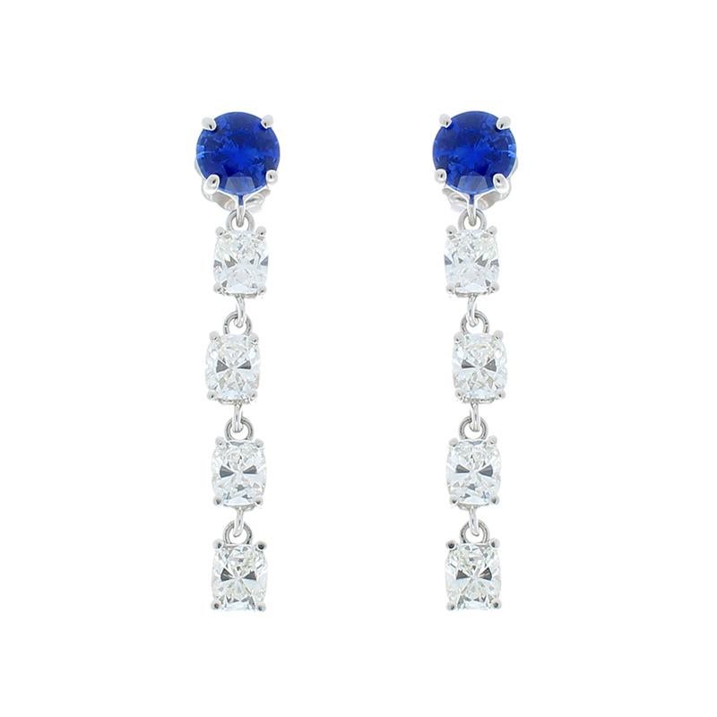 Lavish and luxurious, these sapphire and diamond earrings are exceptionally stunning and elevate your look to incredible heights! The royal blue color of the sparkling Ceylon sapphires draws your eye immediately. These 1.48 carat total sapphires are