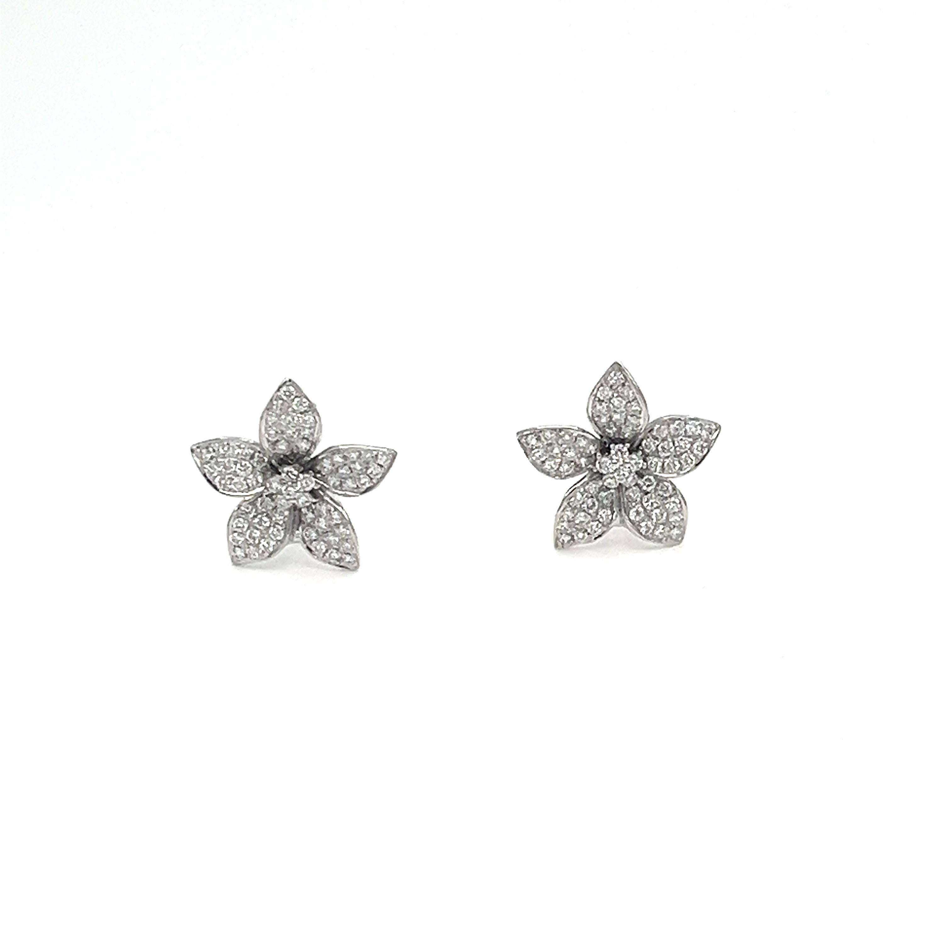 These flowered earrings weighing in at 1.48 ct are set with 142 diamonds with an E/F in color, and a VS1/VS2 in clarity. An excellent addition to any wardrobe. 