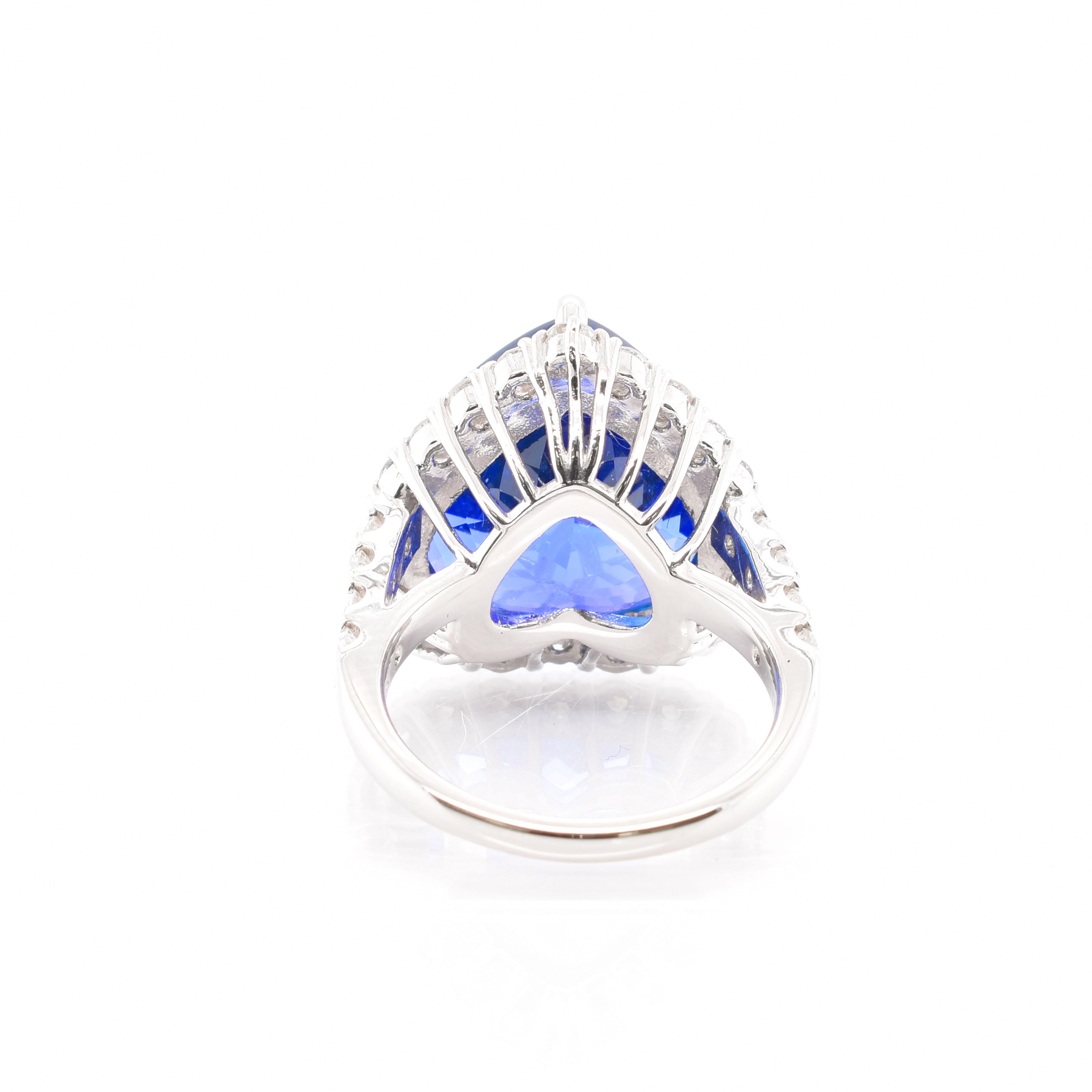 An absolutely stunning Cocktail Ring featuring a 14.80 Carat Heart Shaped Tanzanite with a beautiful violetish blue color and 1.31 Carats of Diamond Accents set in Platinum. Tanzanite is named after Tanzania which is the only known source of this