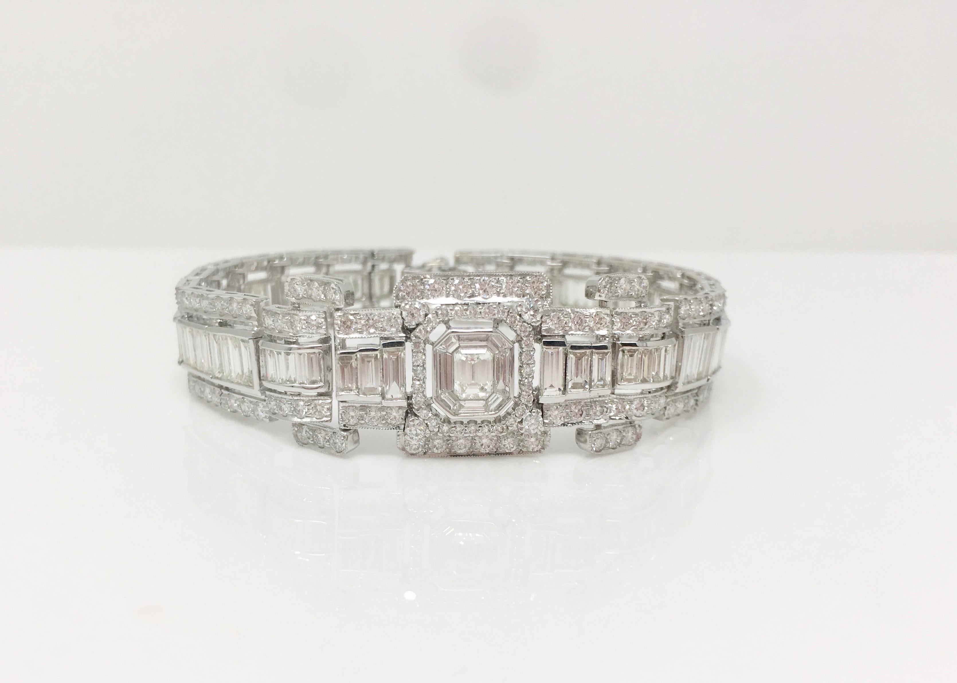 Extraordinary one of a kind hand crafted white diamond bracelet made in 18k white gold featuring white emerald cut diamond in the center weighing .50 carat, white baguettes and white round brilliant cut weighing a total of 14.80 carat with HI color