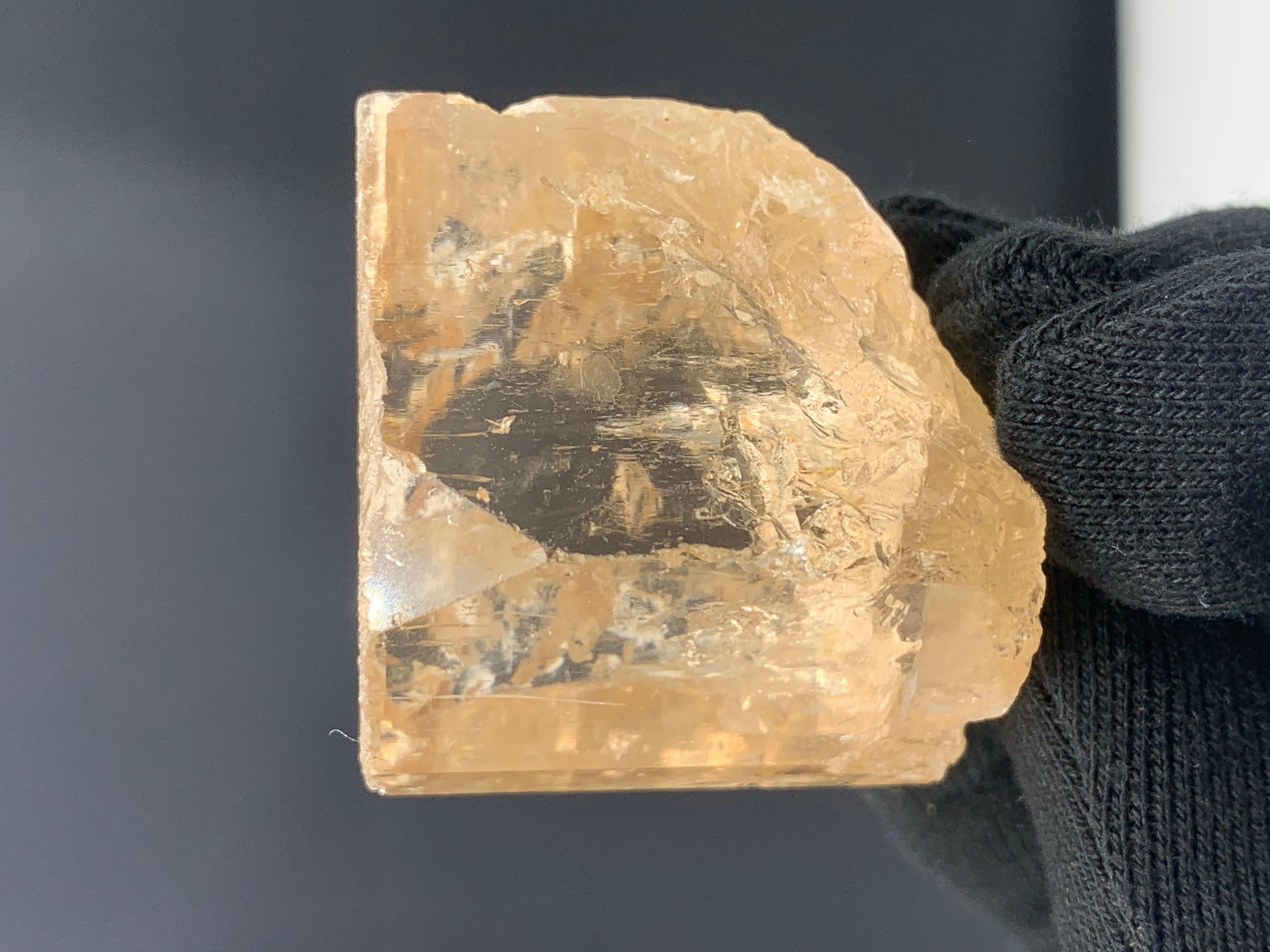 Lustrous Topaz Crystal From Skardu, Pakistan 
Weight: 148.06 Gram 
Dim: 4.1 x 3.7 x 3.3 
Color : Golden
Origin : Skardu, Pakistan 

Topaz is a silicate mineral of aluminium and fluorine with the chemical formula Al₂SiO₄(F, OH)₂. It is used as a
