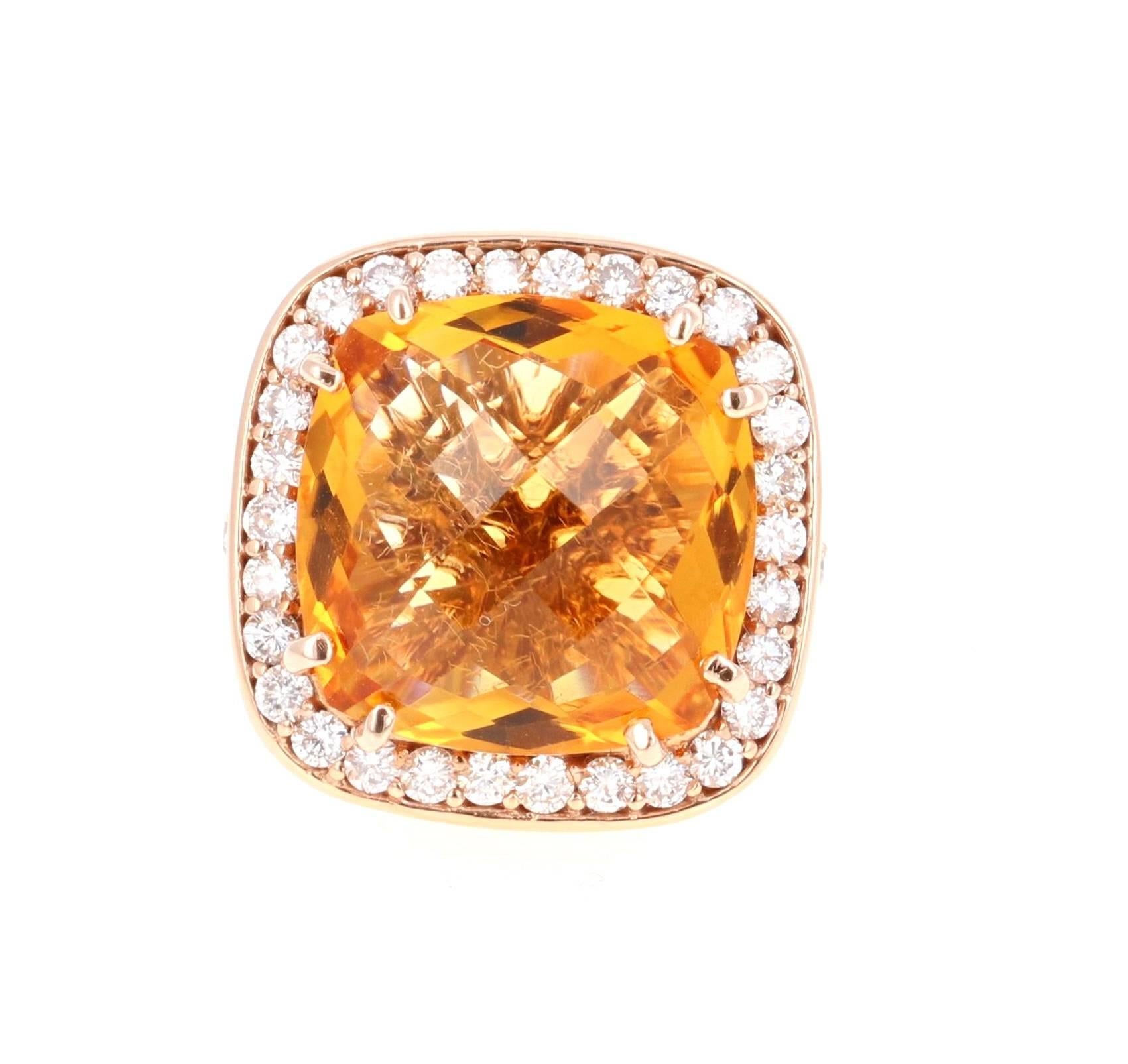 This beautiful ring has a bright orange Citrine Quartz in the center that weighs 12.81 carats. The ring is surrounded by a Halo of 42 Round Cut Diamonds that weigh 1.37 carats (Clarity: SI2, Color: F). The total carat weight of the ring is 14.81