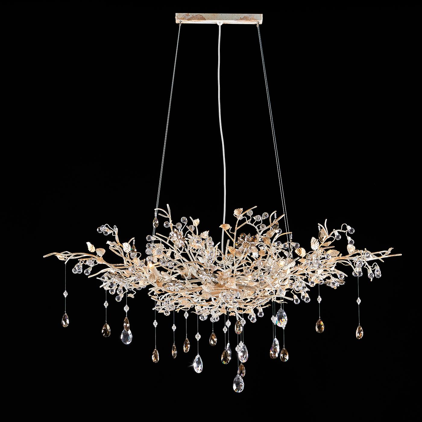 A delicate and classy suspension lamp in white painted metal and inserts in gold leaf. The frame is further enhanced with precious as four crystal spheres, two-tone flowers, and crystal pendants. It provides a great and uniform illumination perfect
