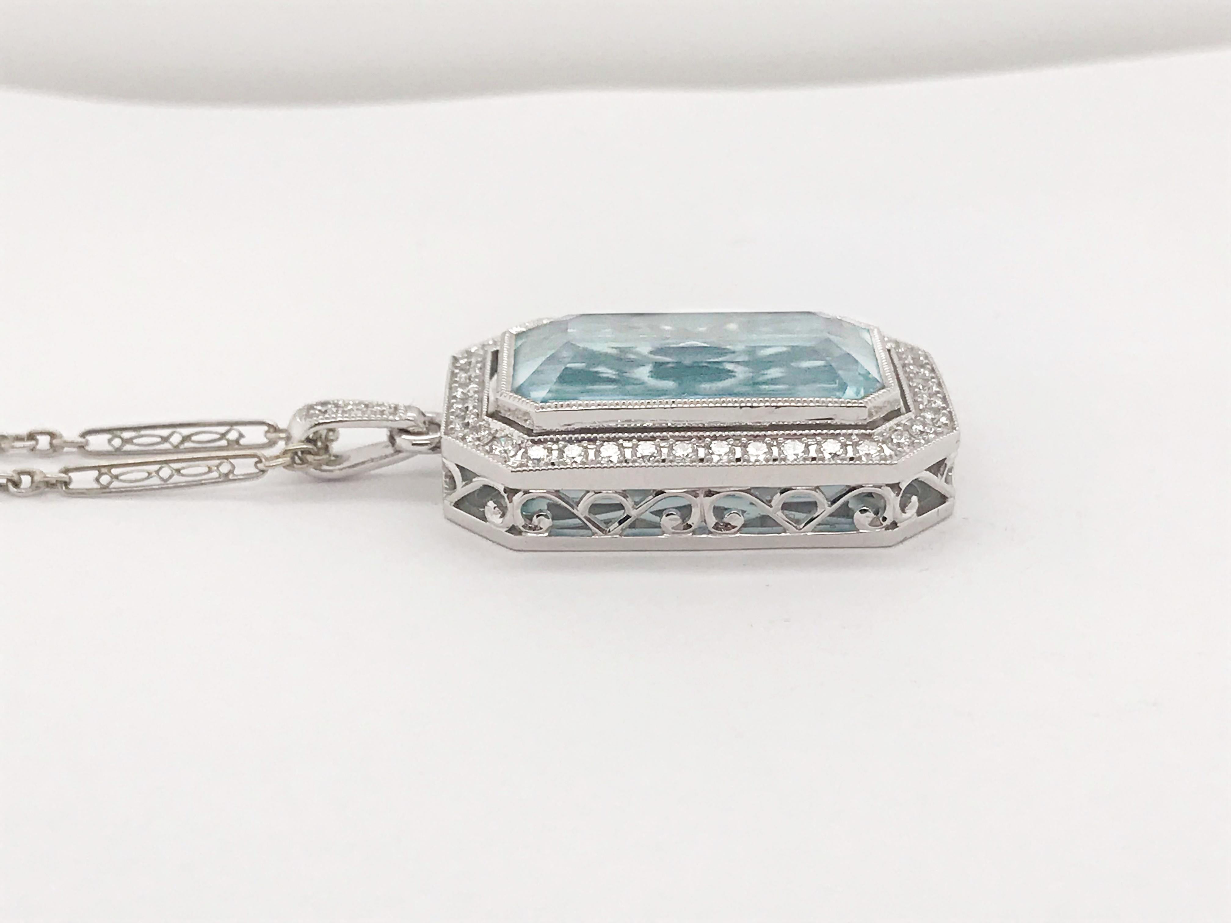 This Aquamarine is stunning in both it's 14.86-carat size and light blue color. The Aquamarine is displayed in a custom pendant made of 14K white gold and featuring 41 round brilliant cut diamonds totaling .81 carats. This pendant is sold on an