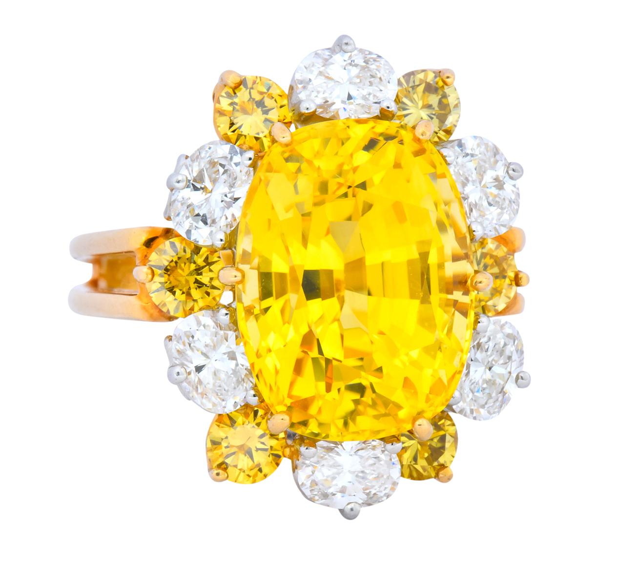 Centering a cushion cut golden yellow sapphire weighing 12.34 carats total, bright vivid yellow with no evidence of heat treatment

In a 