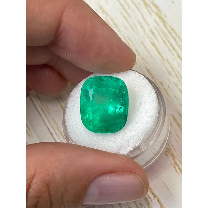 Stone: Emerald
Weight: 14.88-carats
Shape: Cushion Cut
Clarity: Semi-Transparent
Luster: Very Good
Color: Intense Yellowish Green
Measurements: 15.65mm x 13.34mm x 11.74mm
Geographic Origin: Colombia
Treatment: Natural, Oiling

Comments: Due to