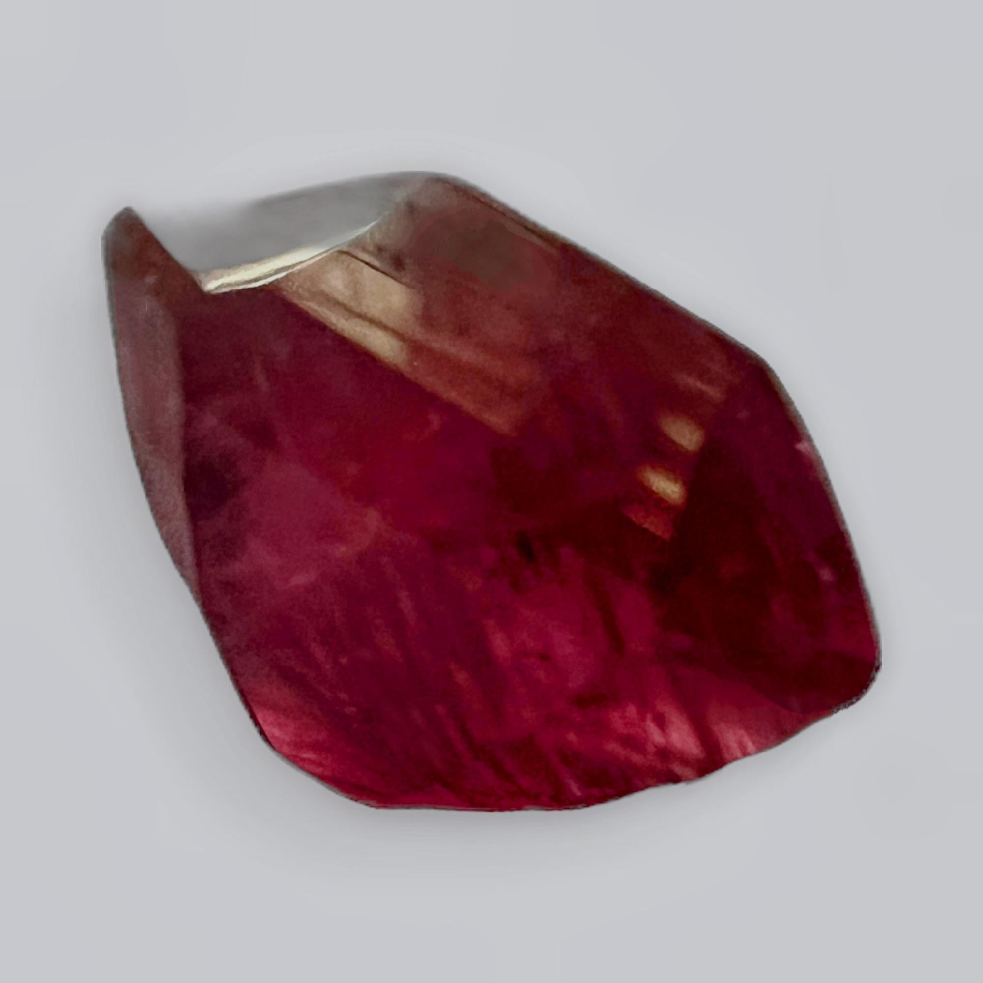 This is a stunningly massive 14.88ct Cushion Cut Intense Red Rubellite Tourmaline. This gemstone is a true testament to nature's artistry, boasting an intense red hue that exudes confidence and allure. This rubellite gemstone is ready to be the